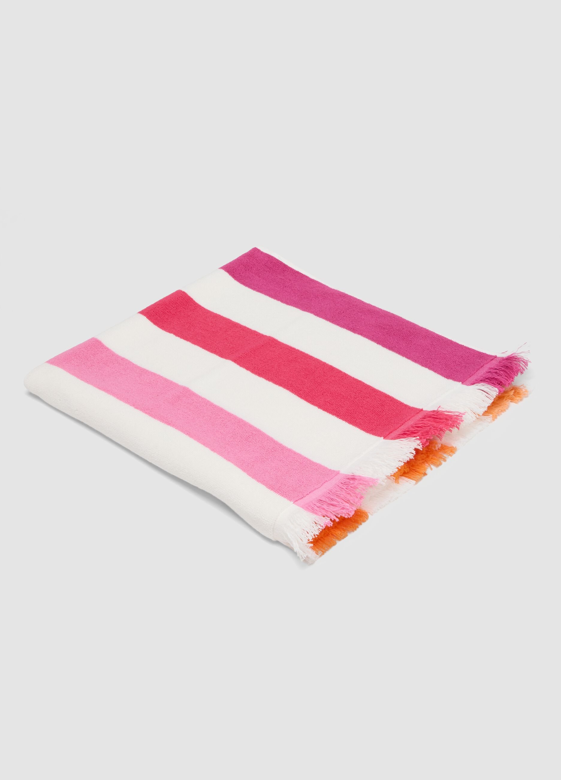 Telo mare multicolor in puro cotone a righe e con frange