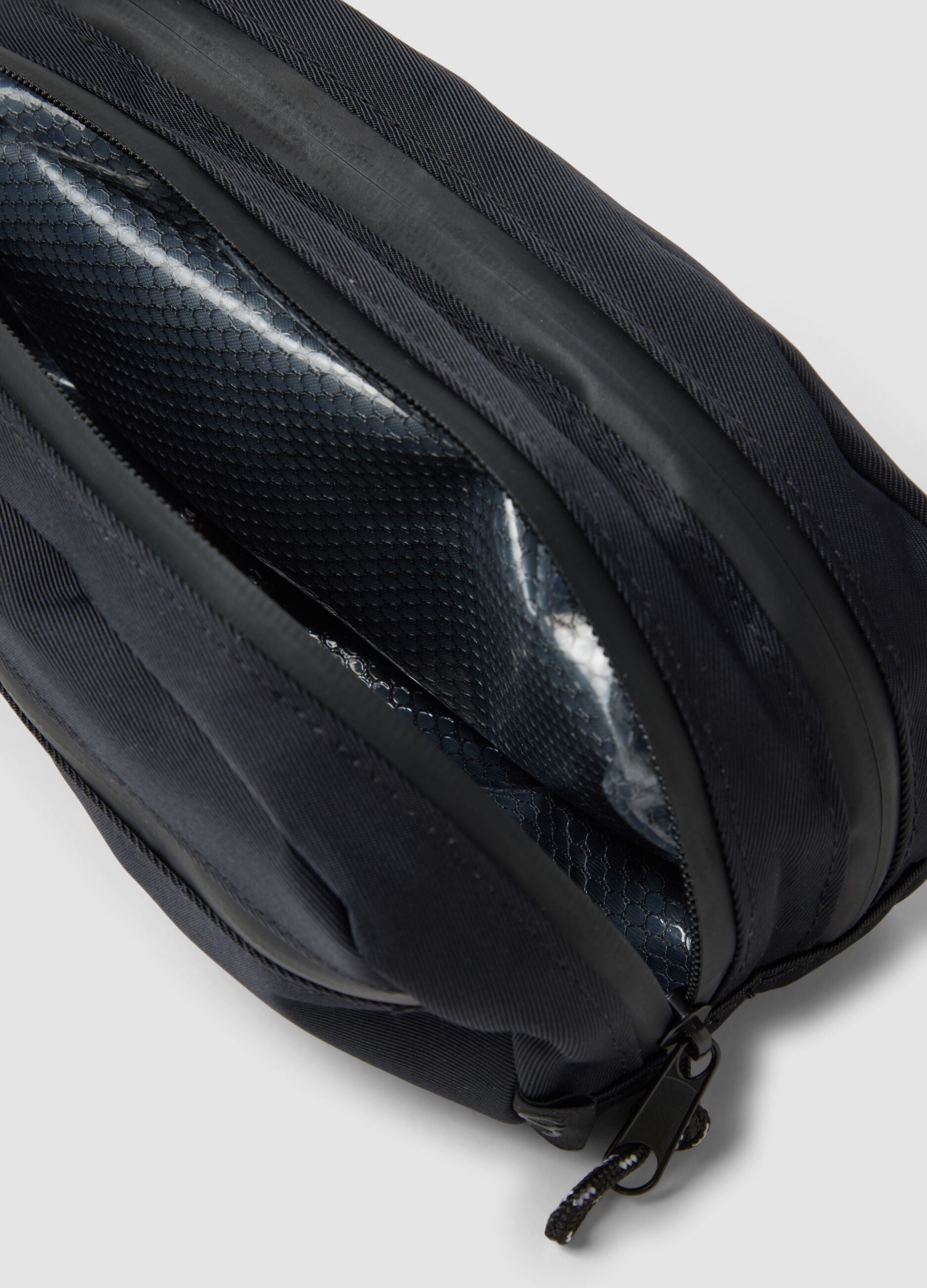 Black toiletry bag with front pocket and zip
