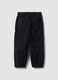 Pantaloni neri in cotone elasticizzato con fondo elasticizzato per bambino_6