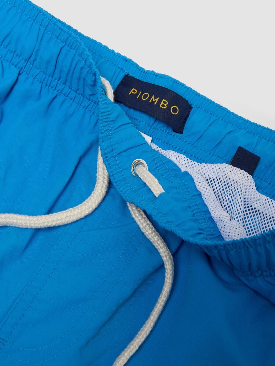 Blue swim shorts with elasticated waistband and contrast drawstring_5