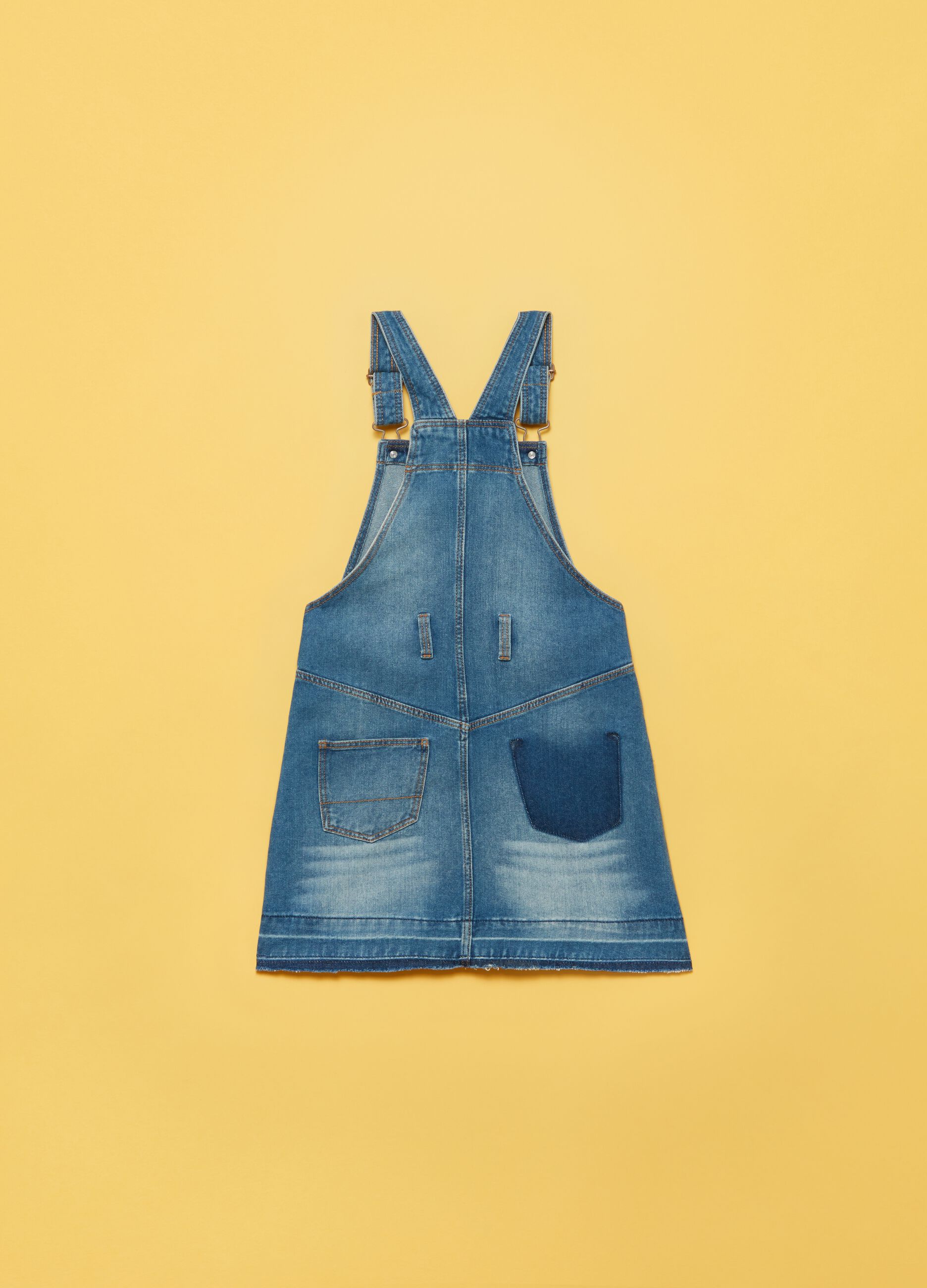 Denim dungarees with raw edging