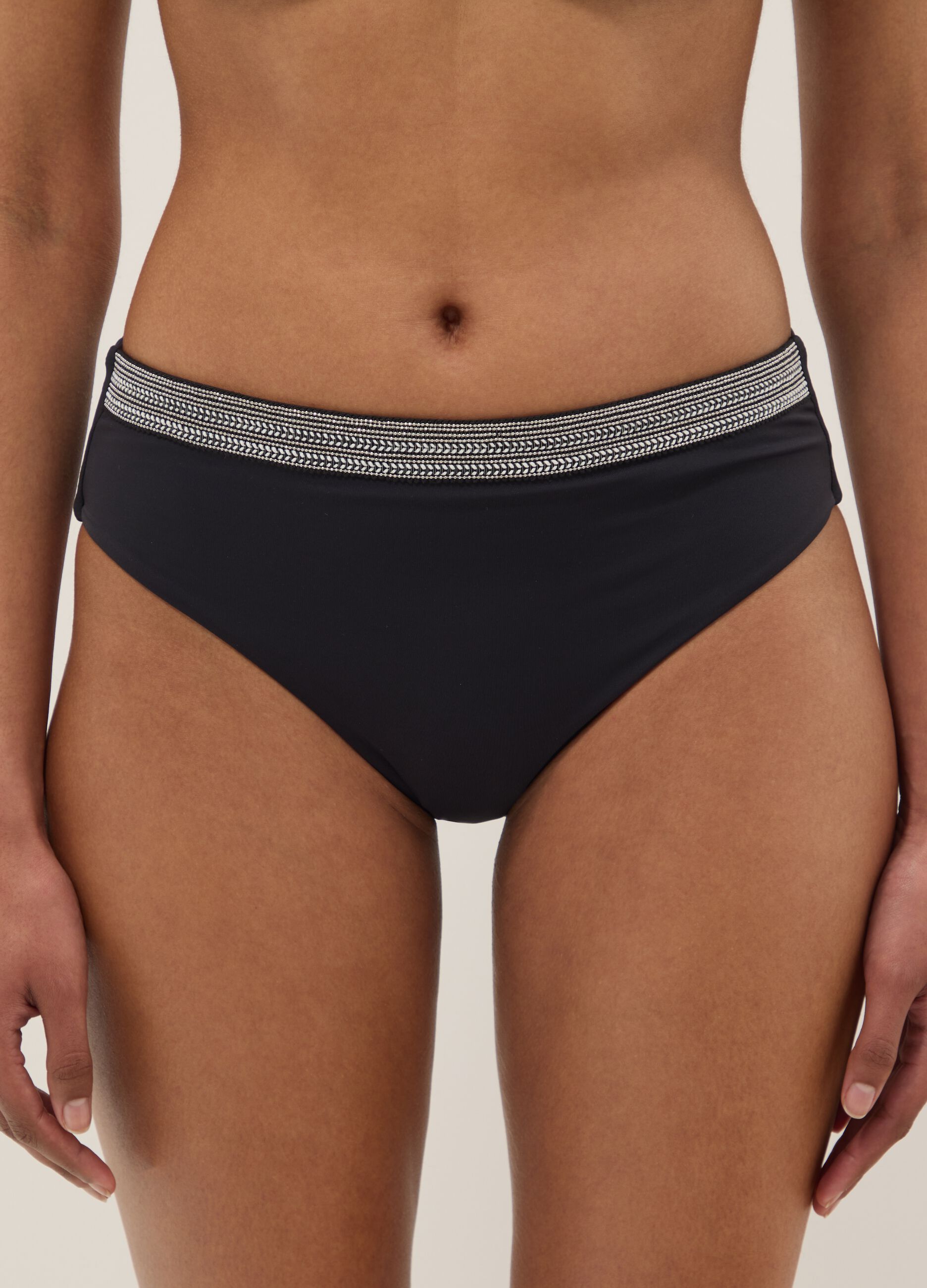 Black stretch swim briefs with embroidered details