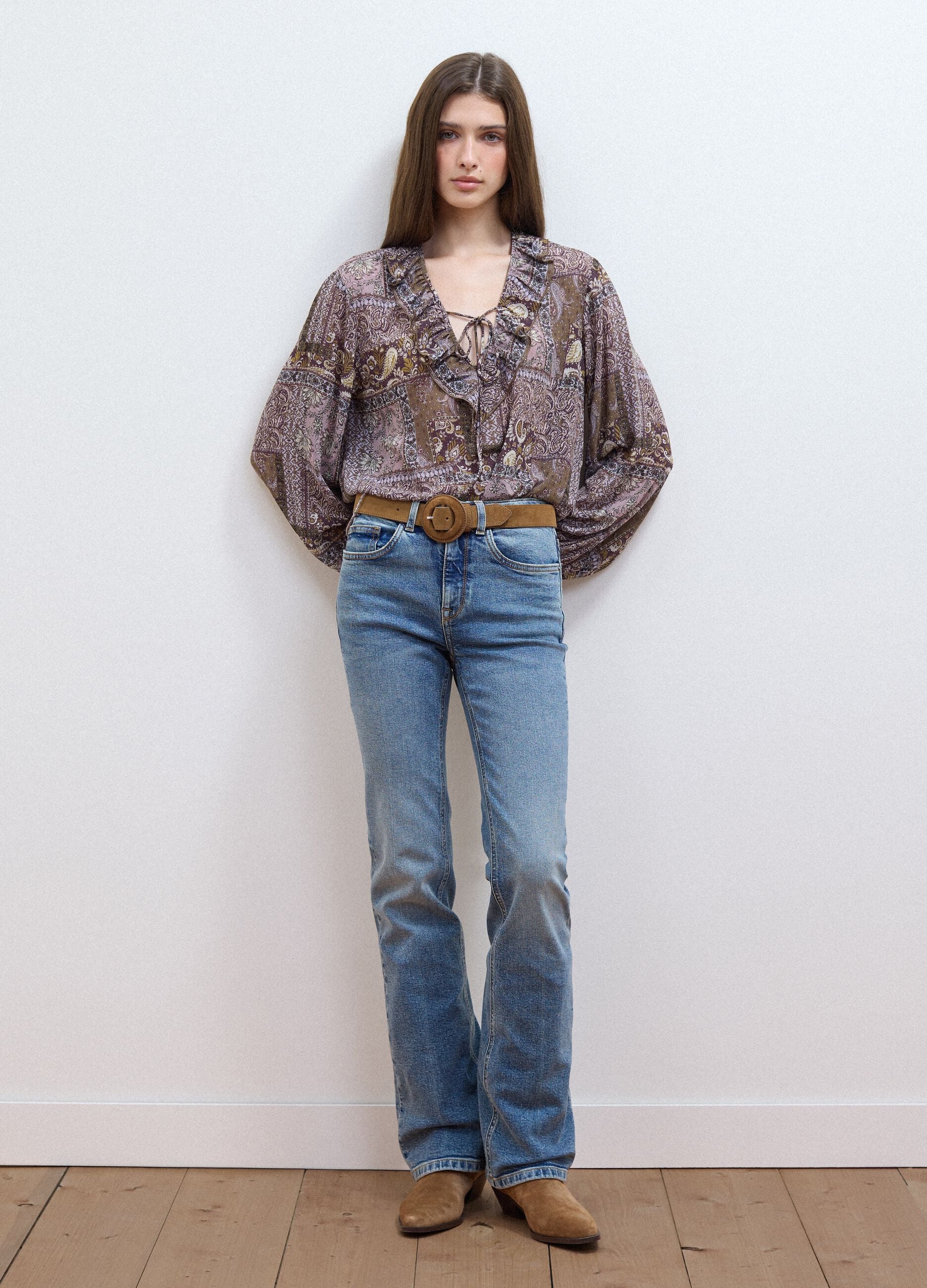 Purple patterned blouse with ruffles and tie neck