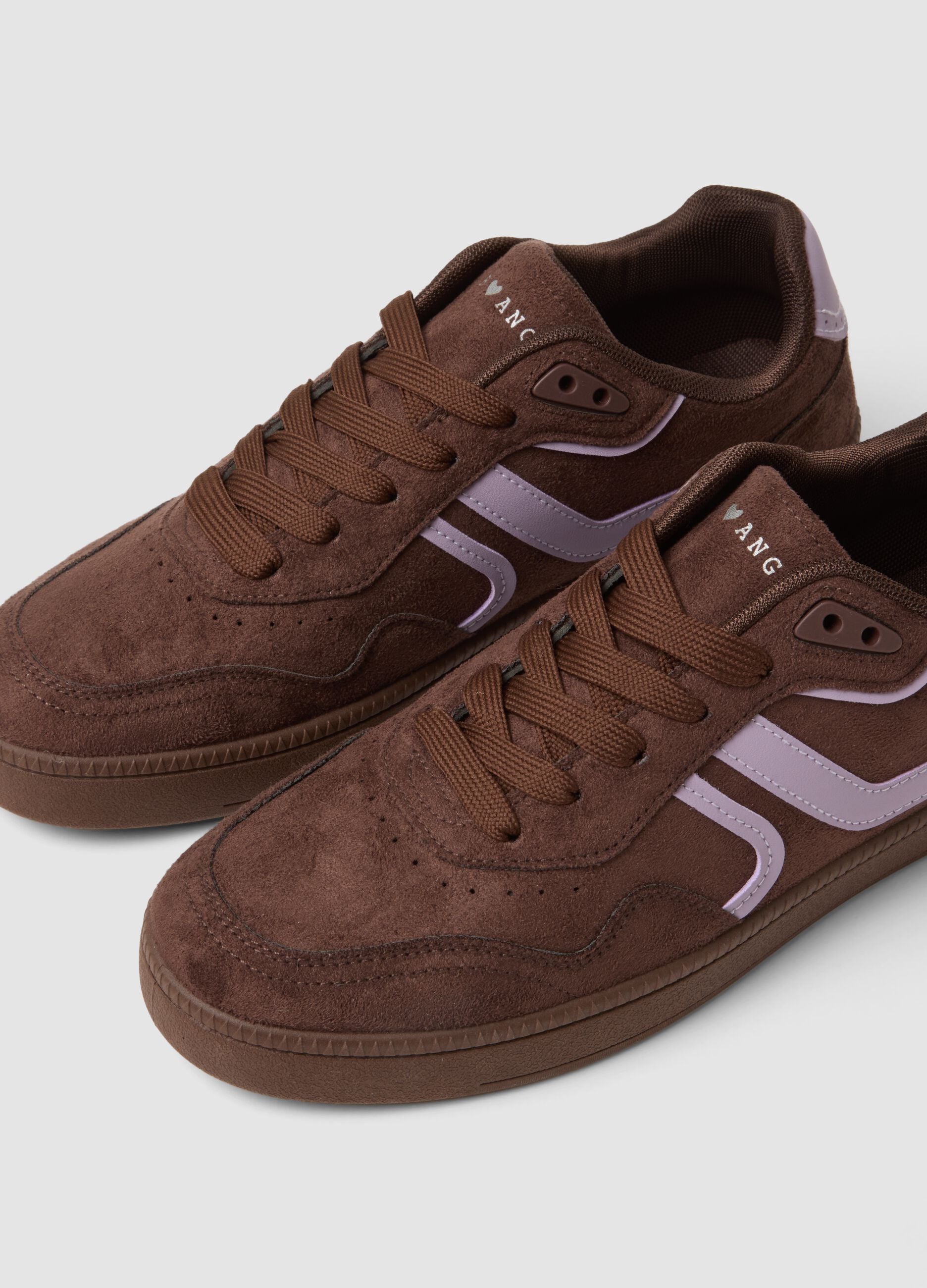 Brown trainers with pink inserts