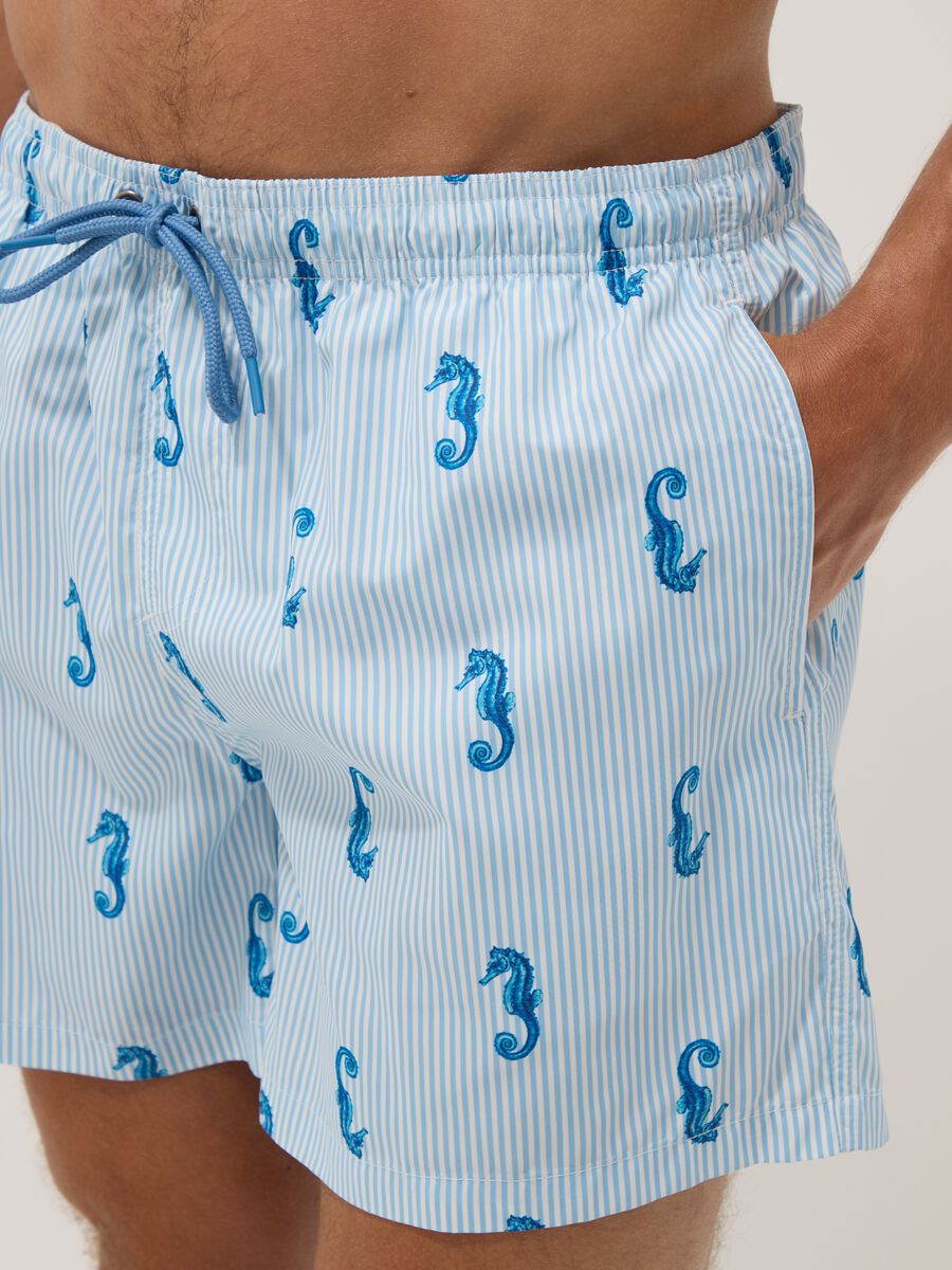 Blue striped swim shorts with seahorse print_3