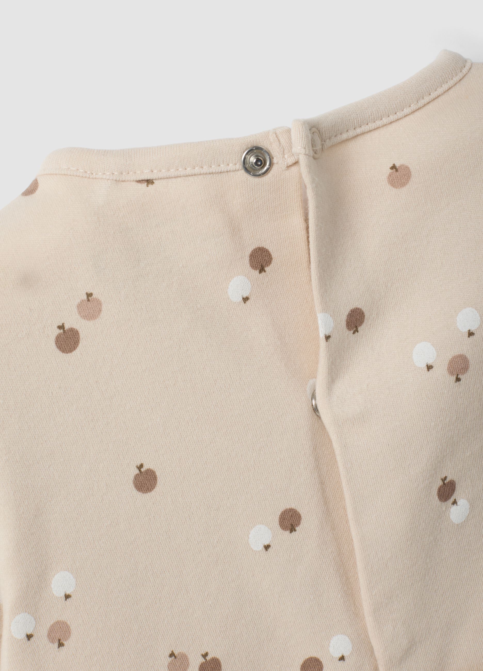 2-pack of white and beige printed organic cotton sleepsuits