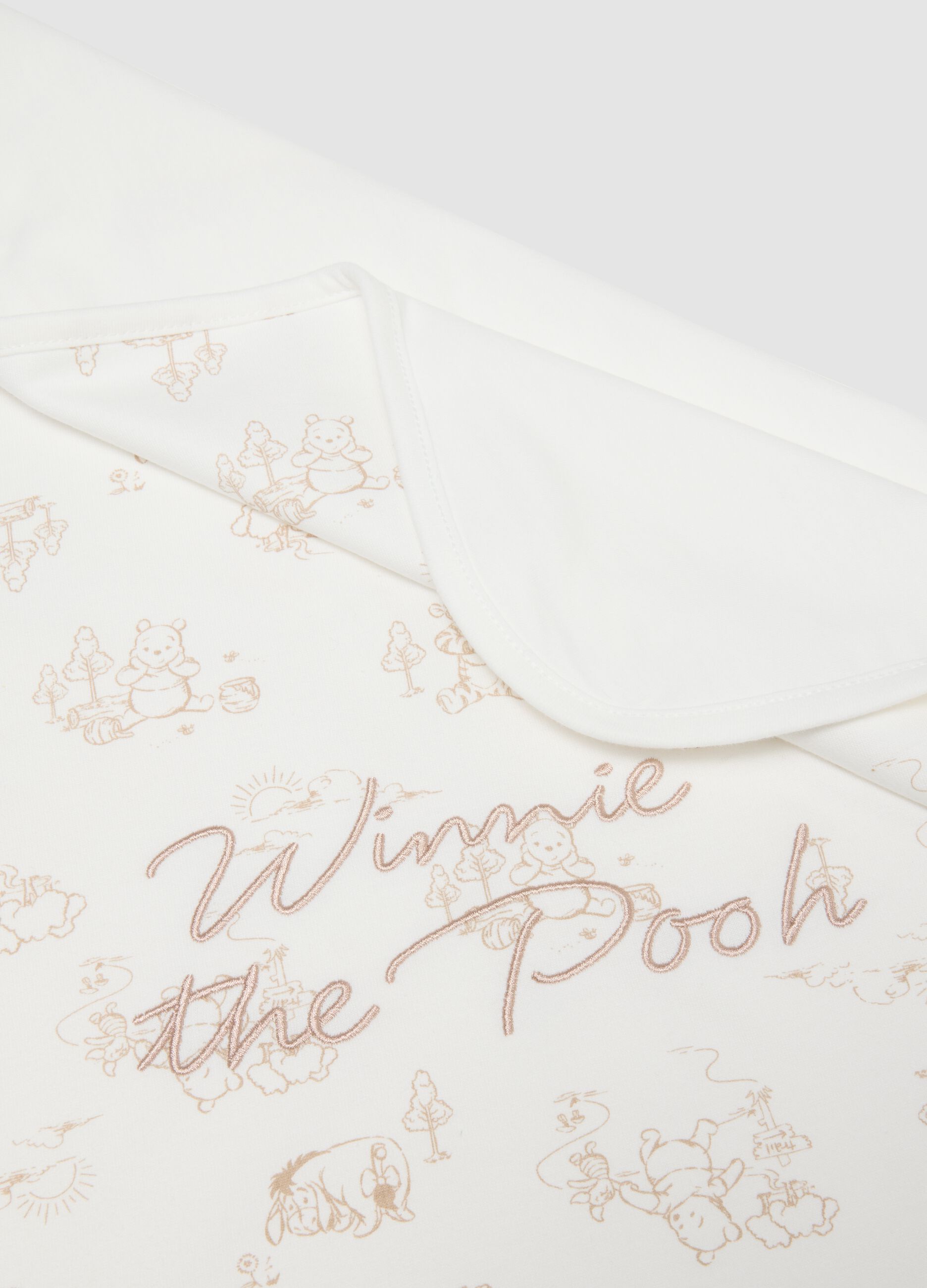 White organic cotton baby blanket with Winnie-the-Pooh