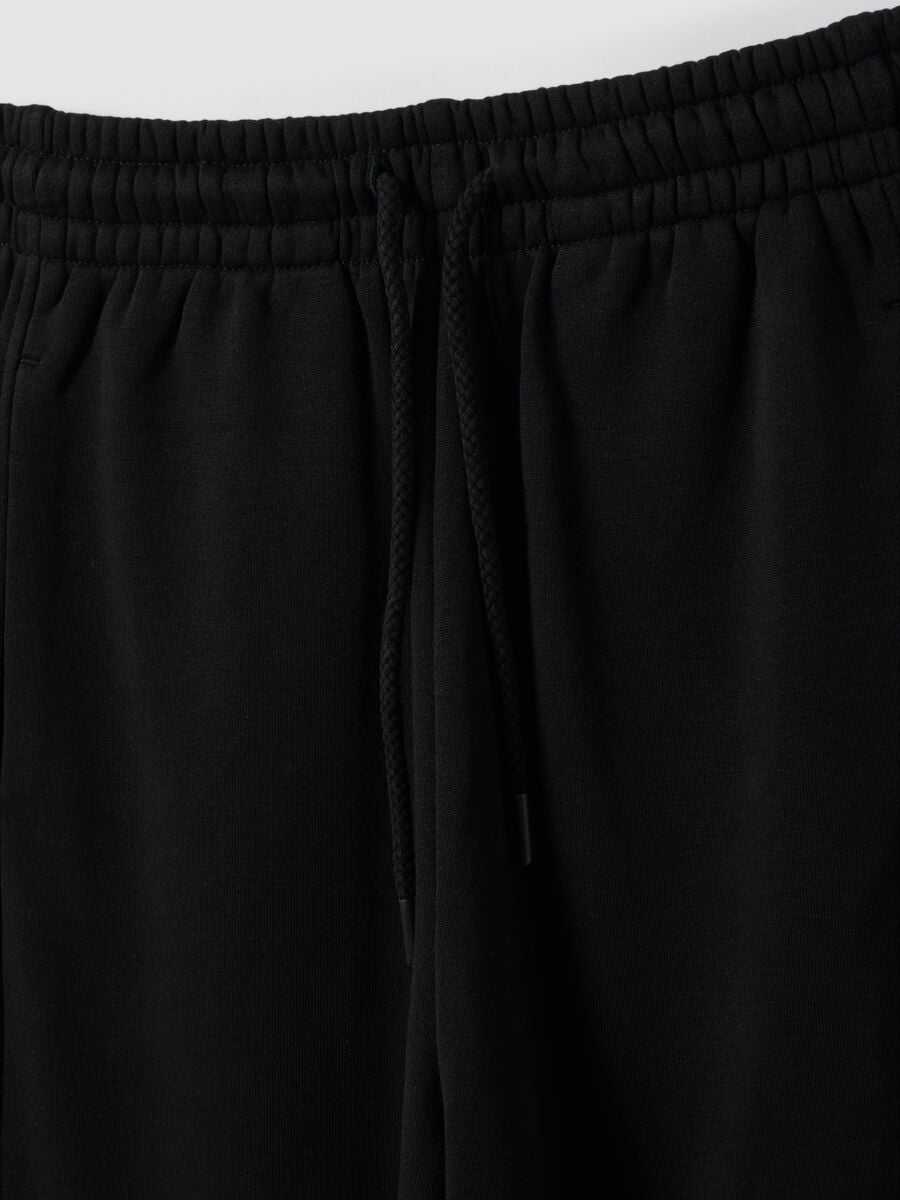 Black barrel-fit cotton-blend joggers_1