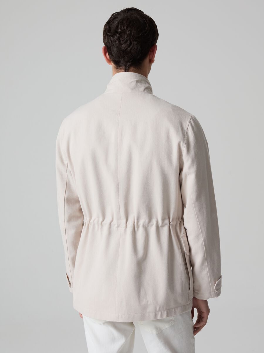 Contemporary short jacket with high neck_1