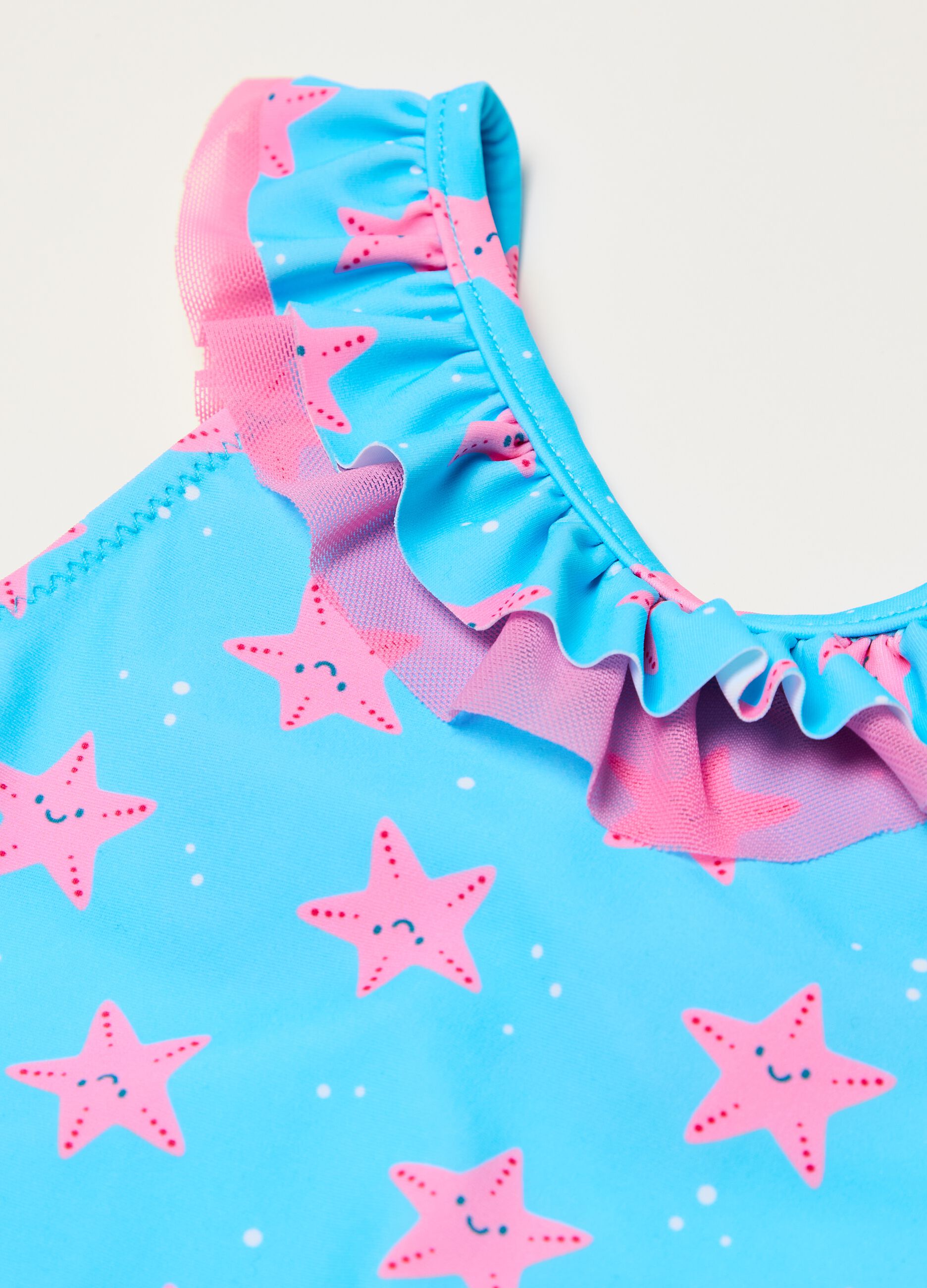 One-piece swimsuit in tulle with starfish print