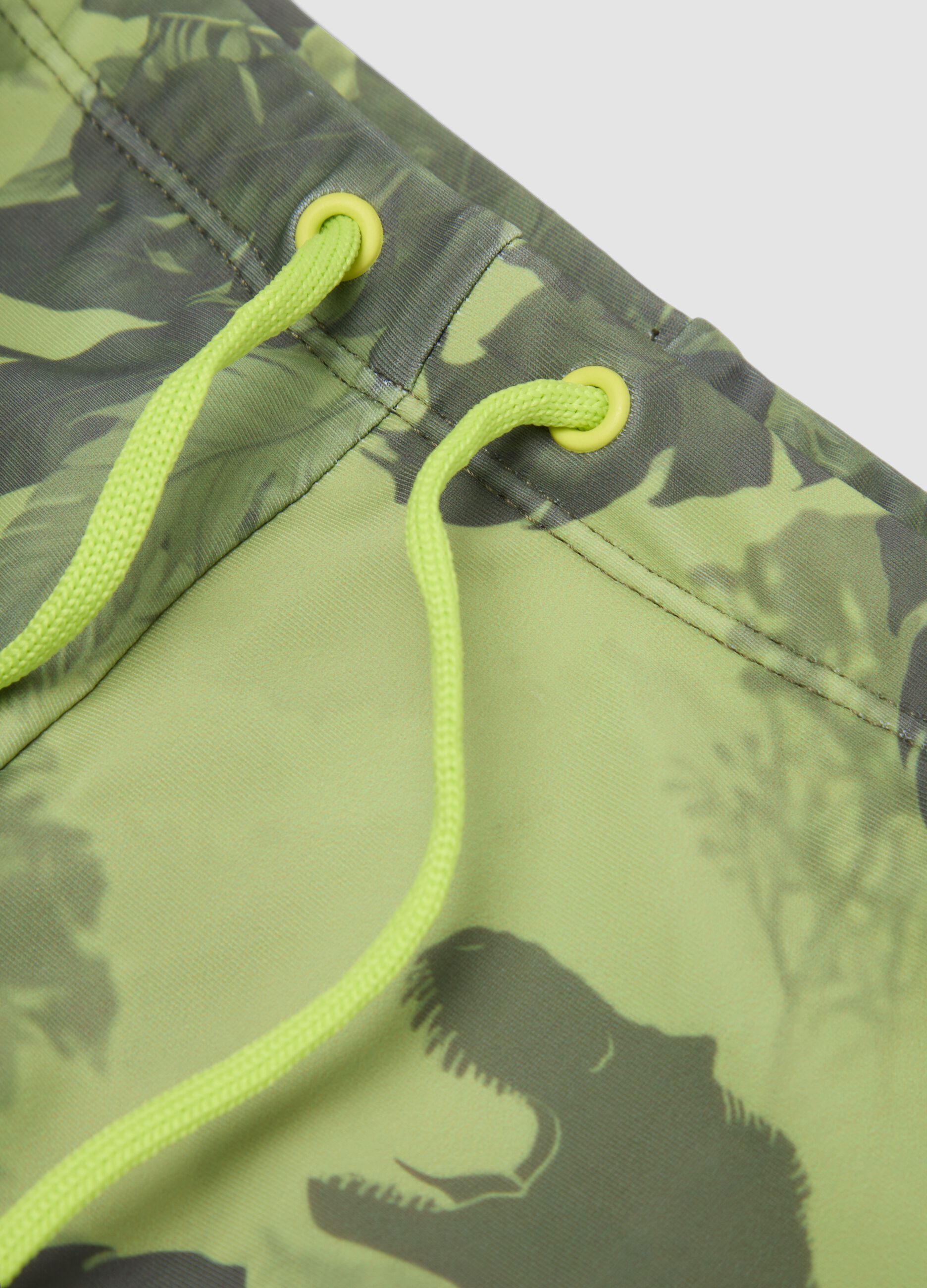 Gr&uuml;ne Stretch-Badehose mit Dino-Print