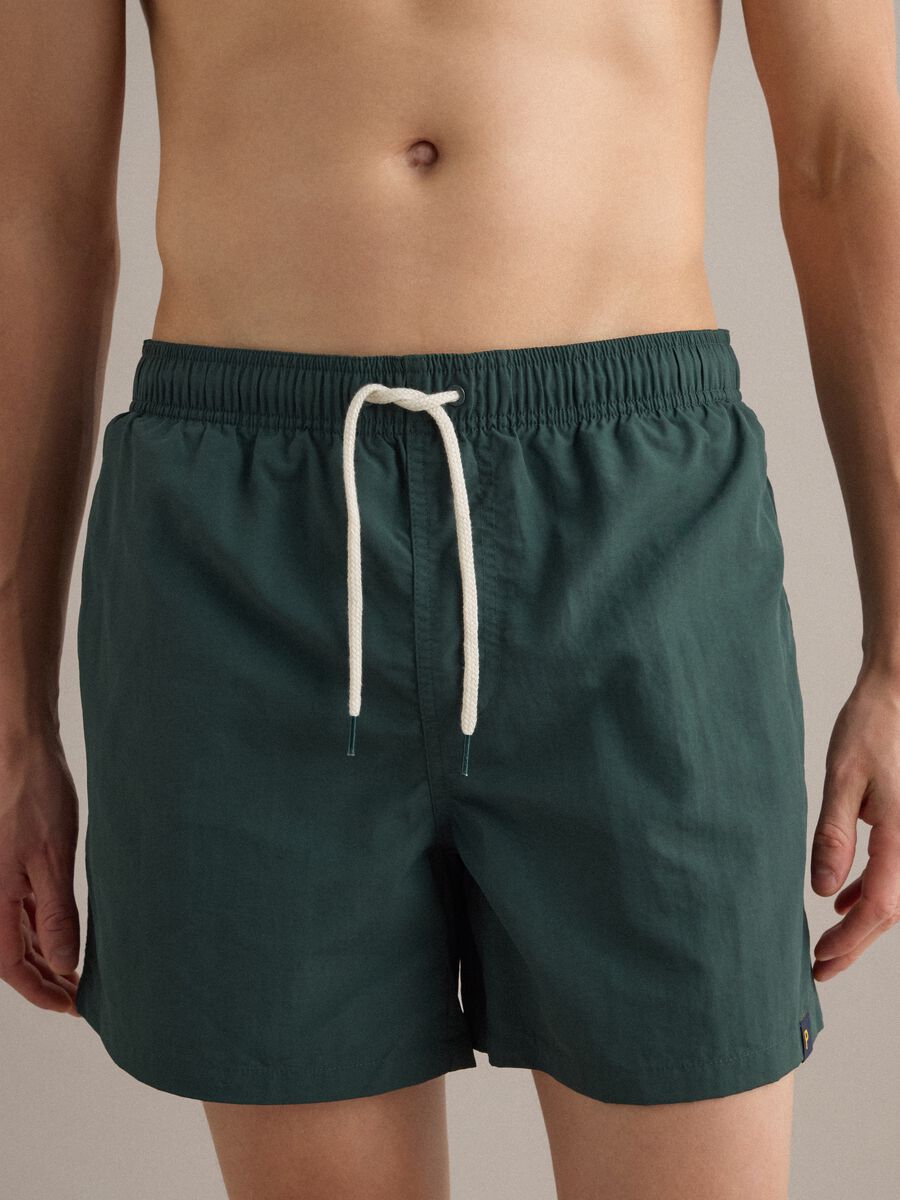 Green swim shorts with elasticated waistband and drawstring_2