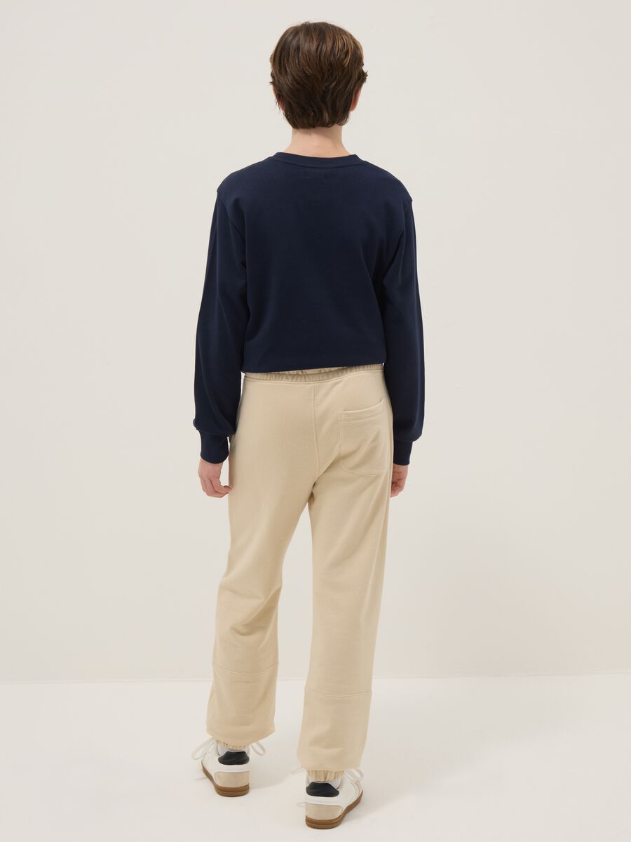 Beige jogger trousers for boys in pure organic cotton regular fit_1