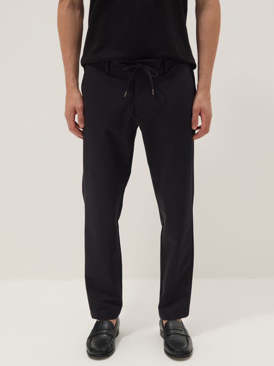Black stretch carrot-fit chino trousers_1