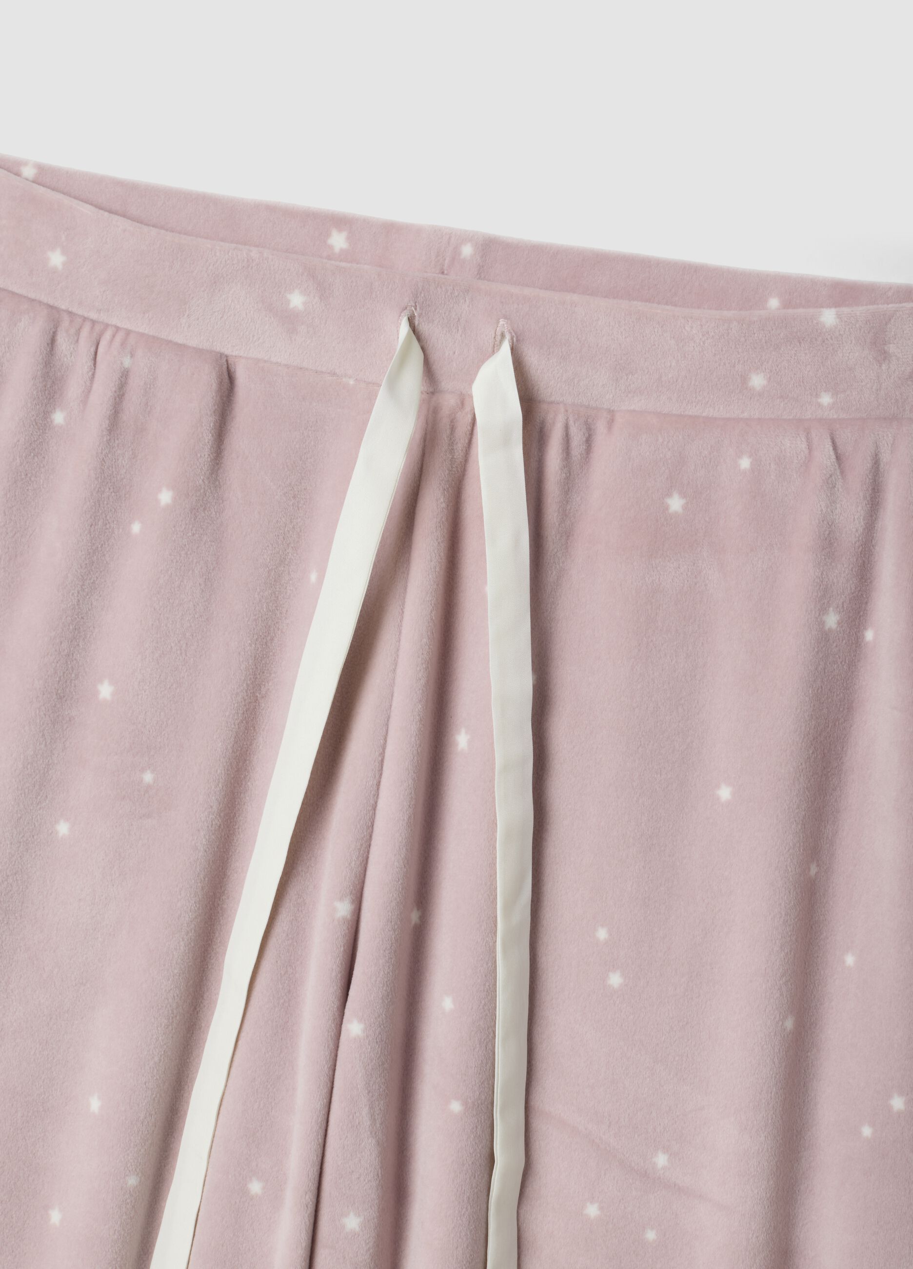 Cal&ccedil;as de pijama roxas em tecido el&aacute;stico com estrelas