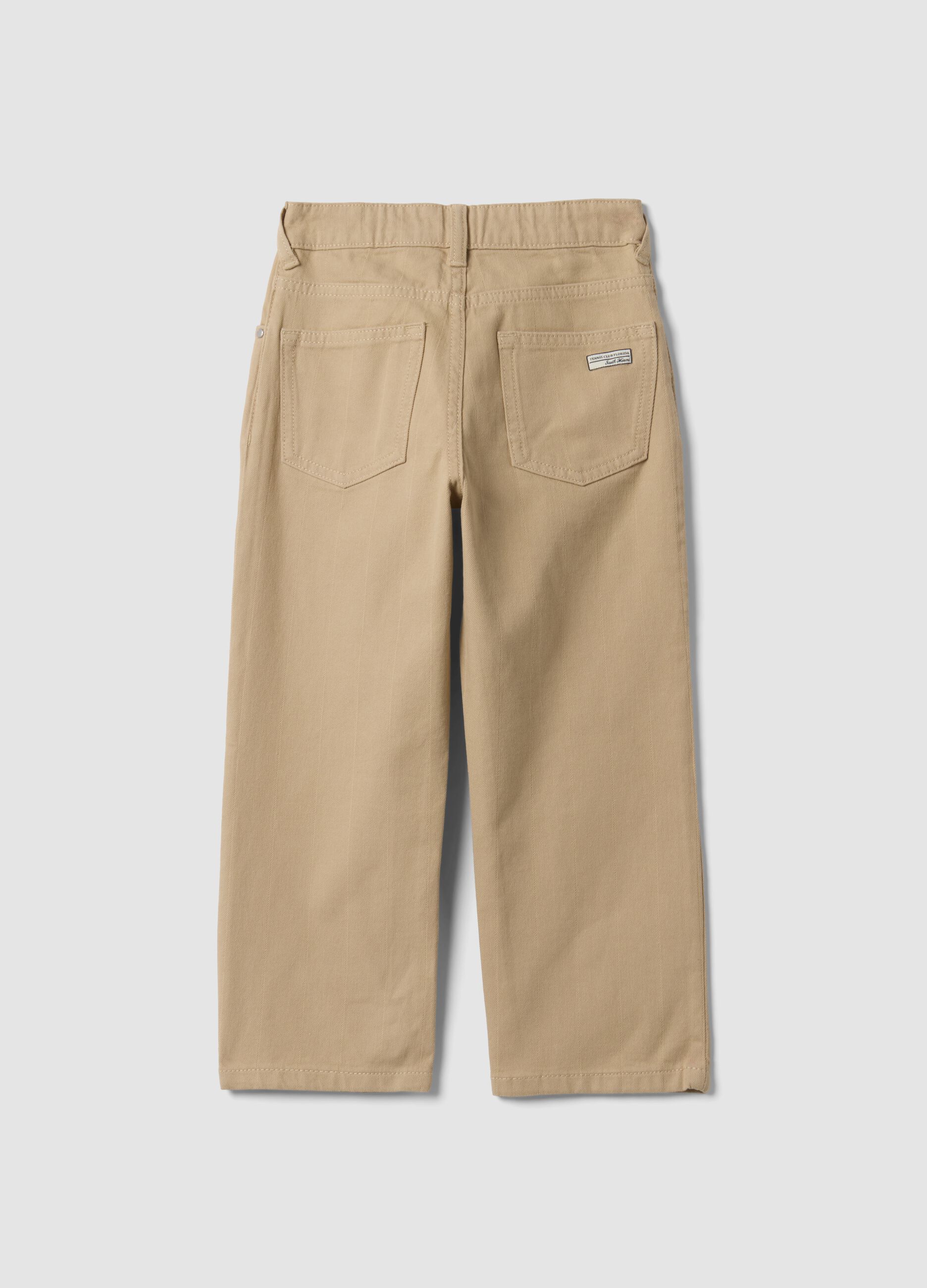 Pantaloni beige in cotone elasticizzato relaxed fit per bambino