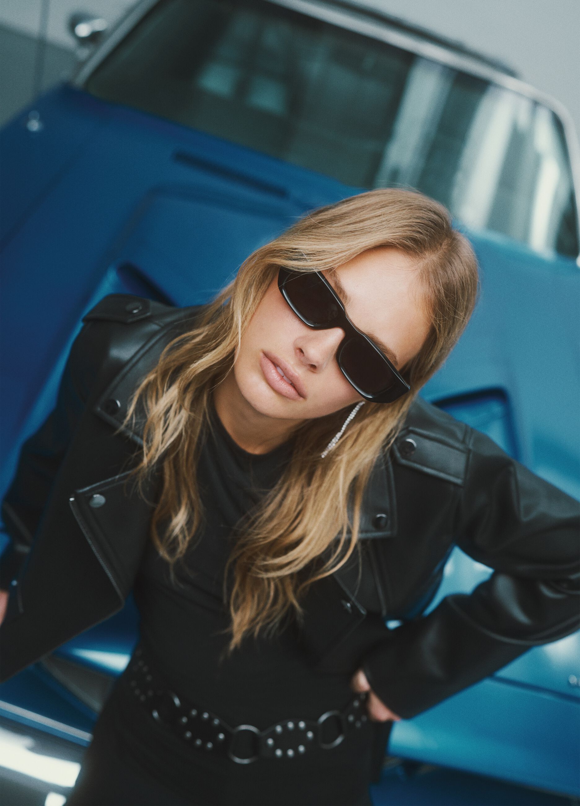 Black biker jacket regular fit with metallic details and diagonal zip