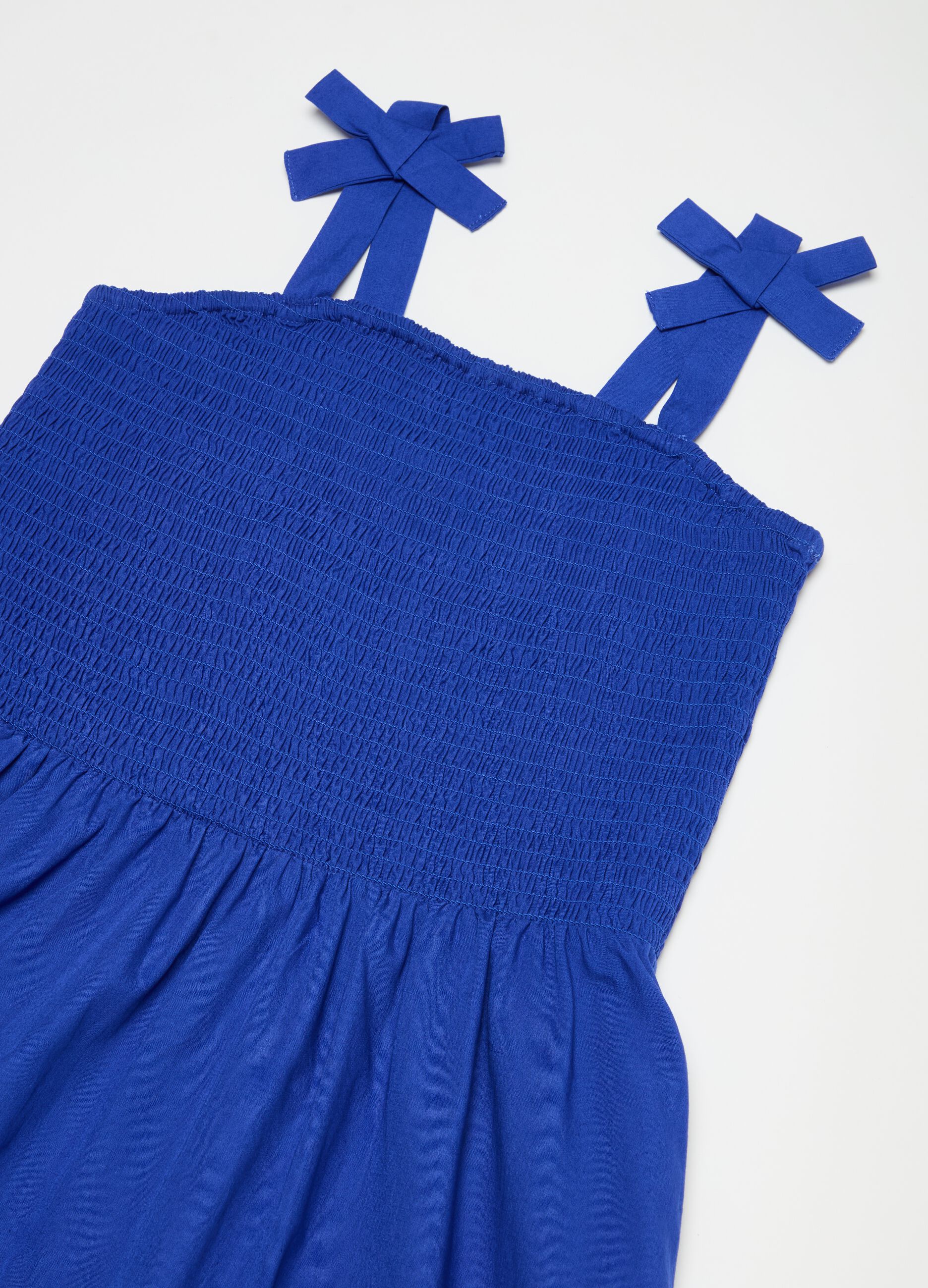 Sleeveless dress with smock stitch