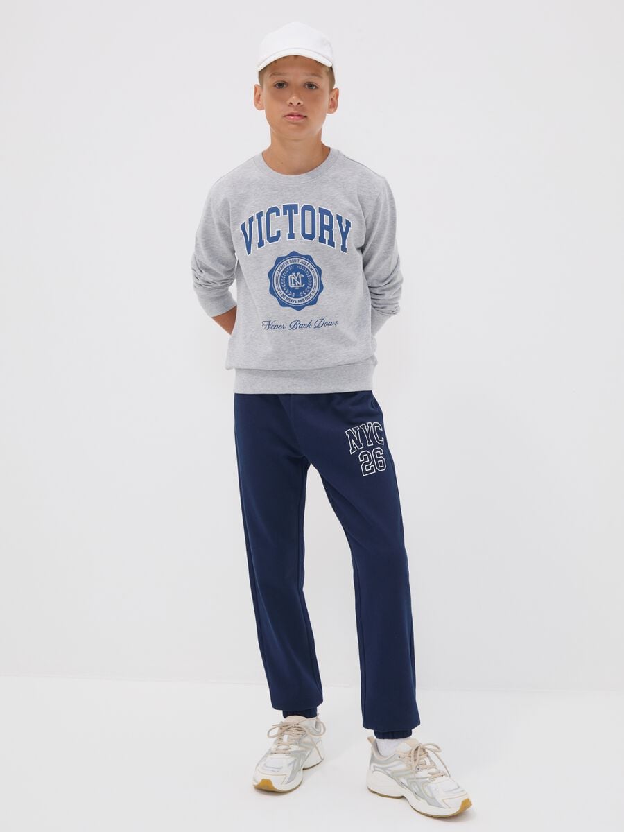 Blue pure cotton joggers with college print for boys_0