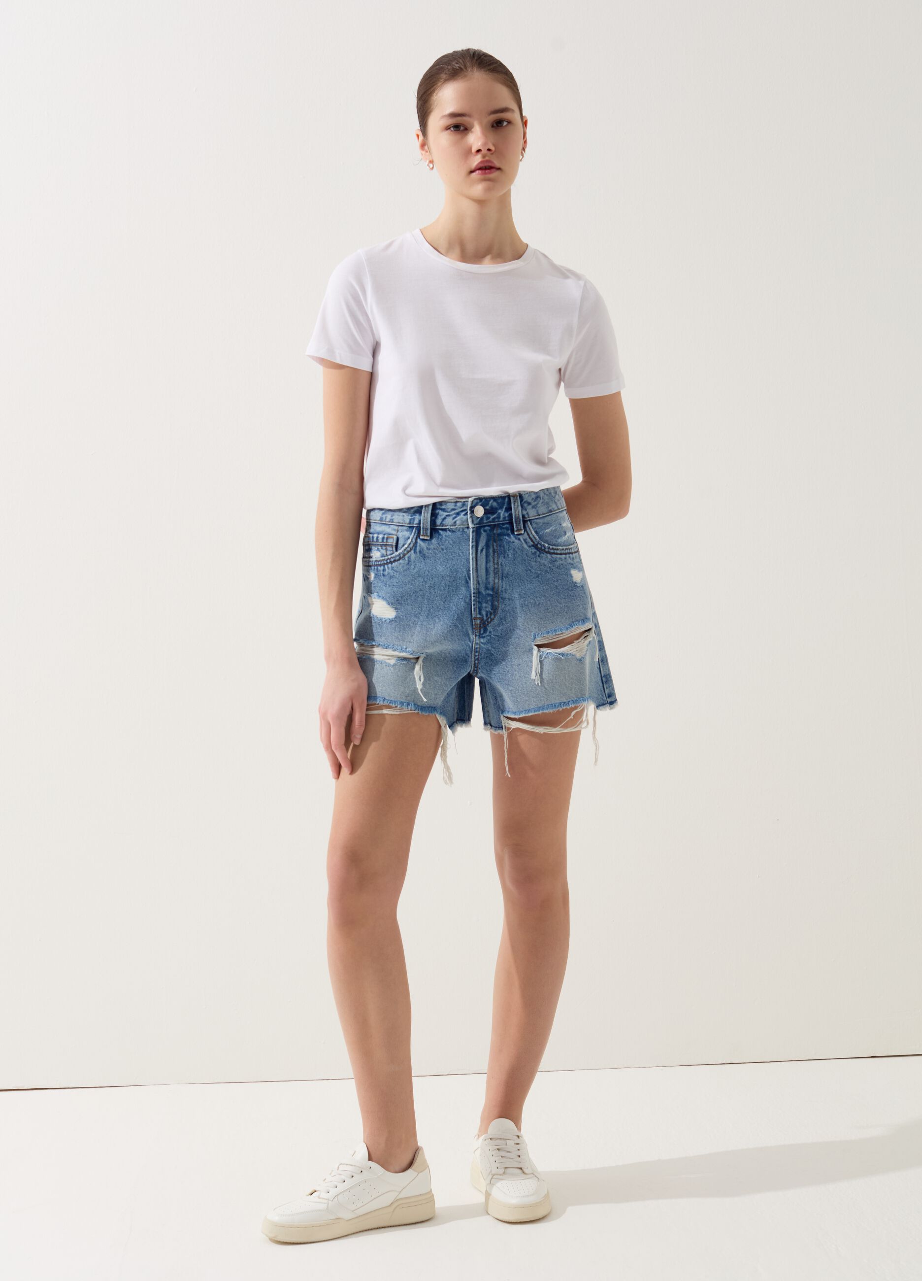 Denim shorts with rips and high waist