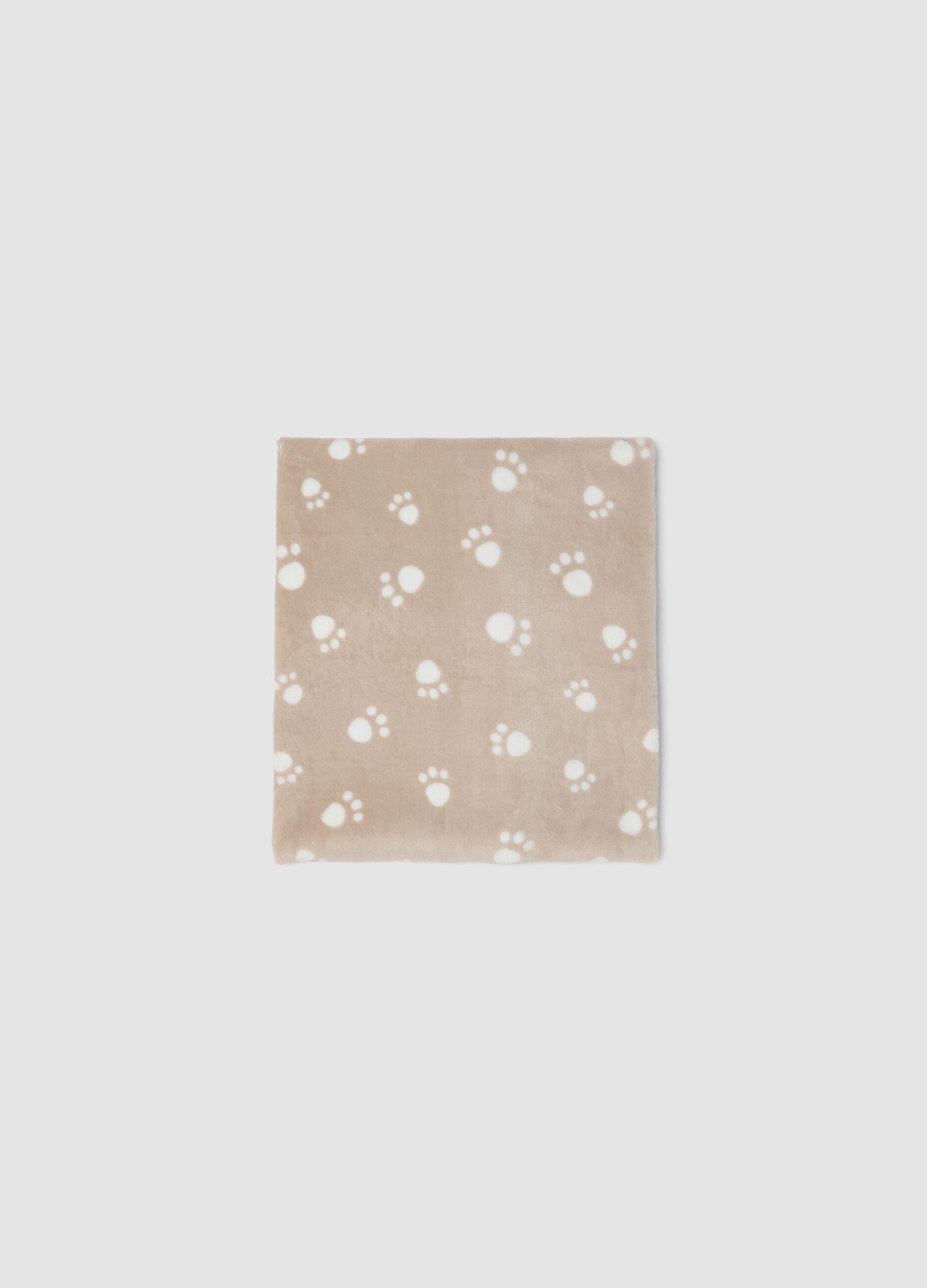 Copertina beige con stampa zampette per neonati
