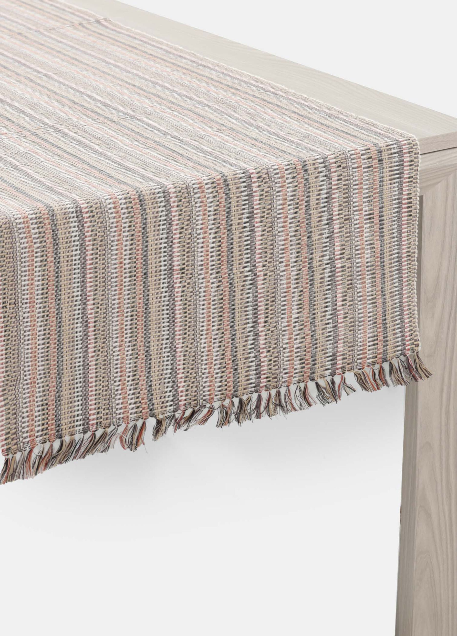Cotton table runner with fringed edges