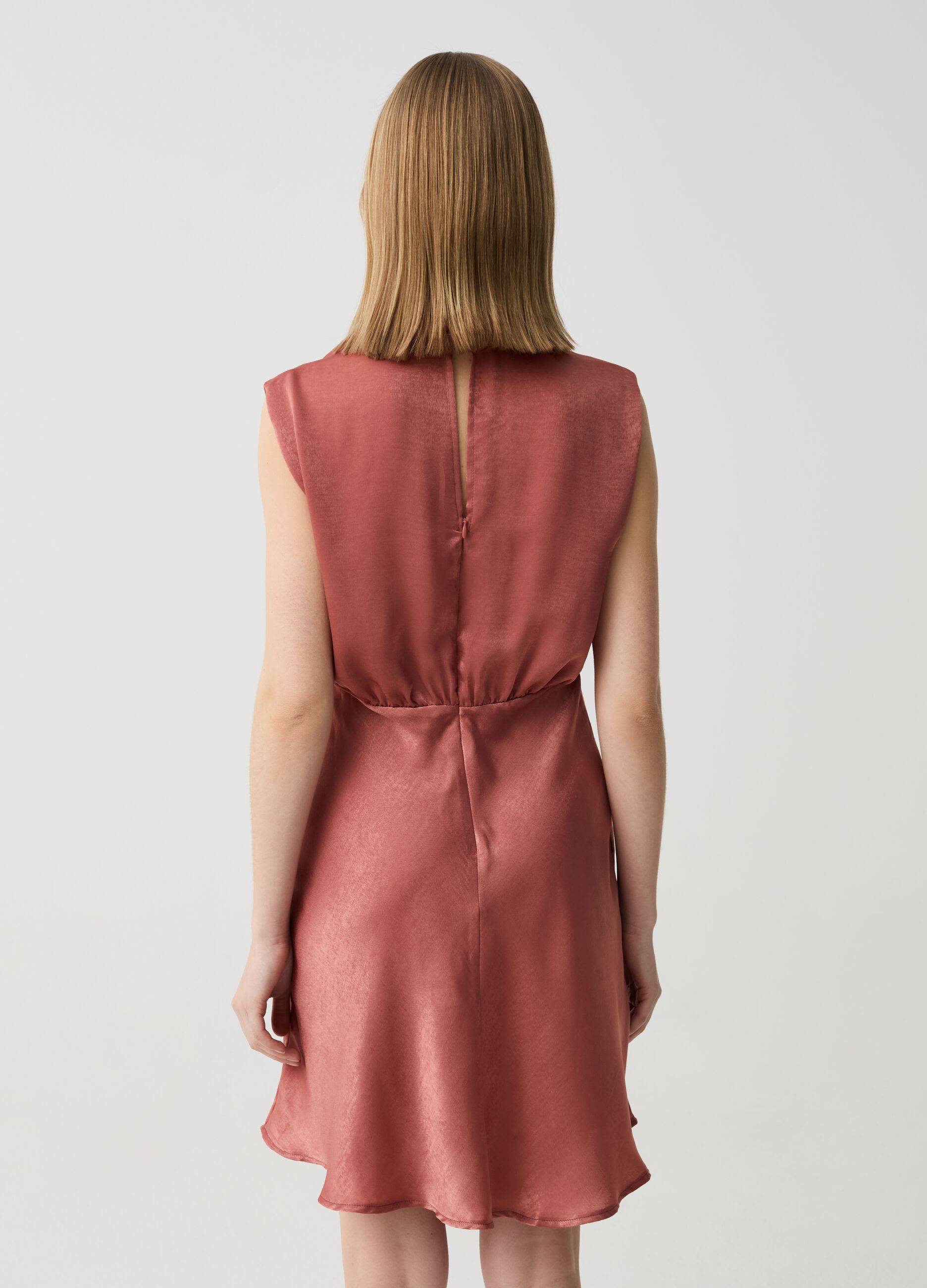 Sleeveless dress in satin with draping
