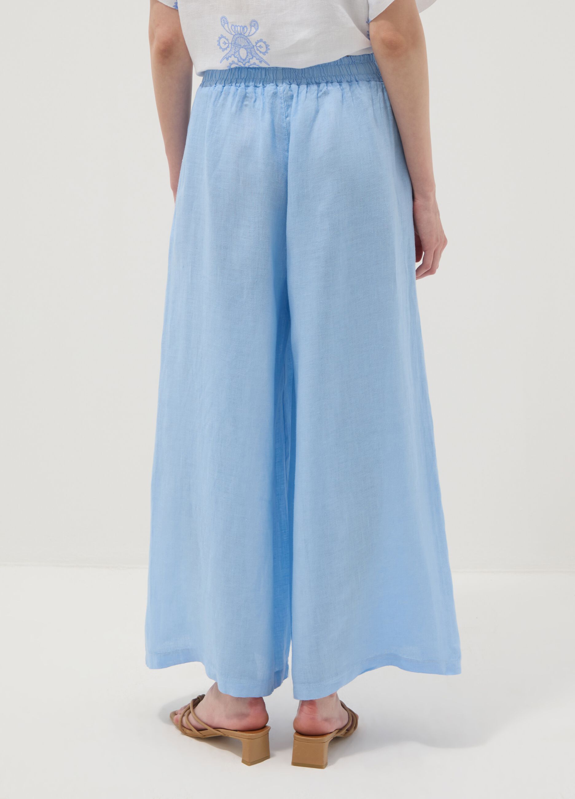 Light blue pure linen wide-leg trousers with a regular fit