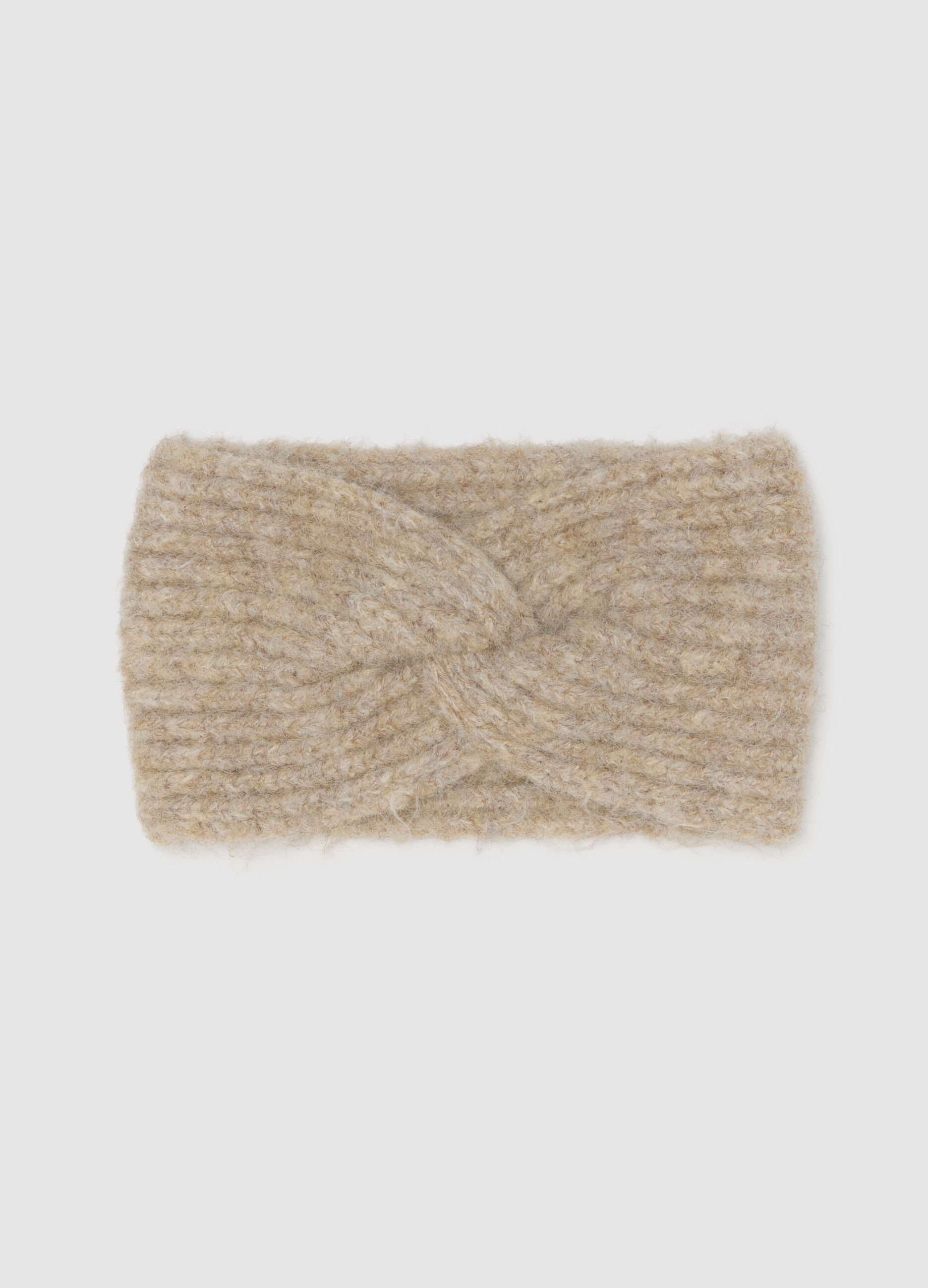 Beige band with knitted braided design