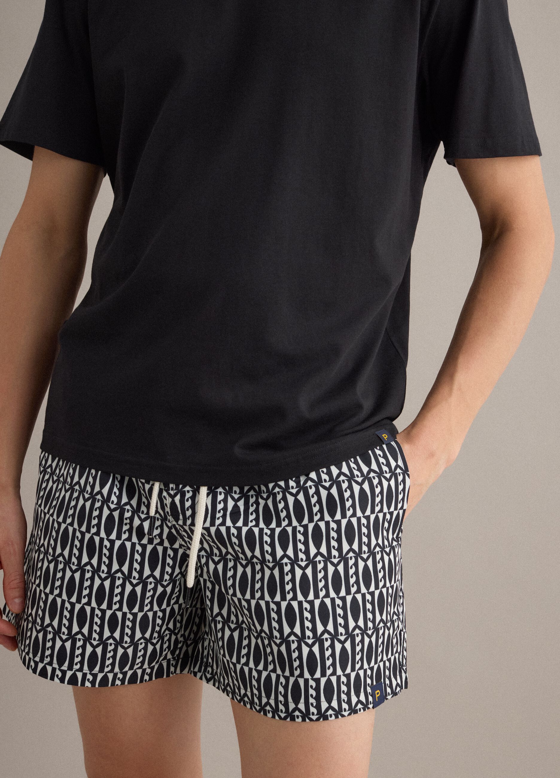 Blue swim shorts with graphic print