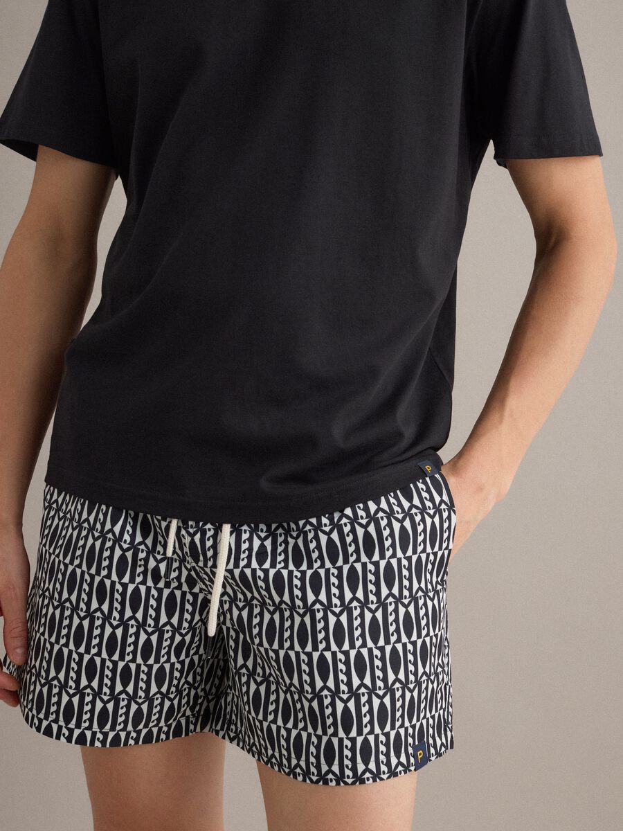 Blue swim shorts with graphic print_2