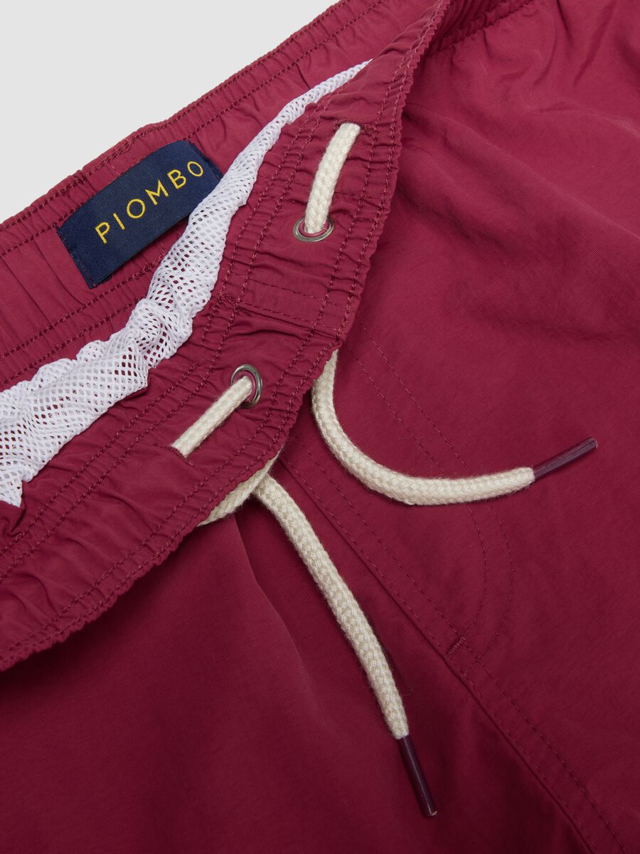 Red swim shorts with elasticated waistband and drawstring_5