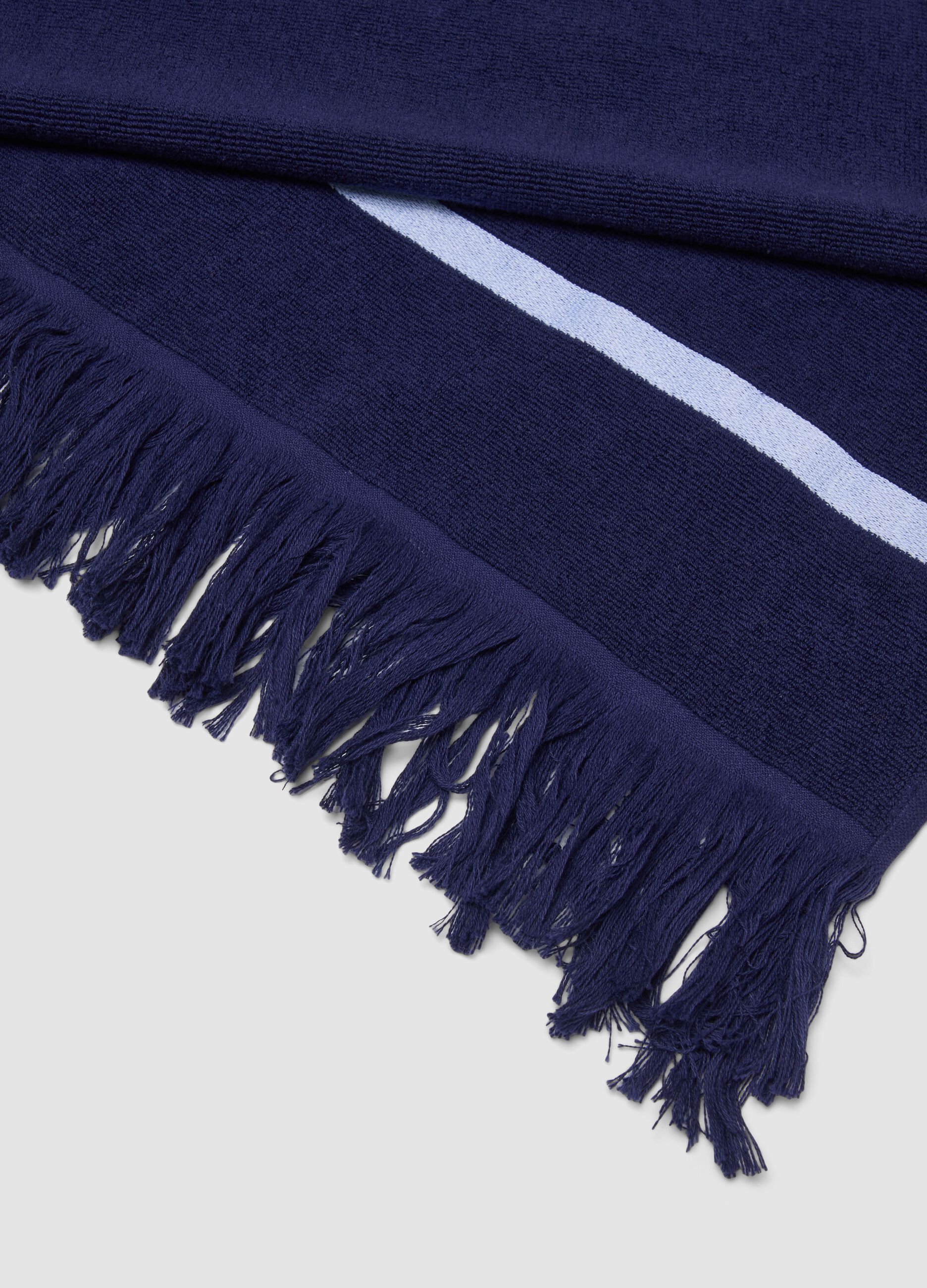 Blue cotton-blend beach towel with fringes