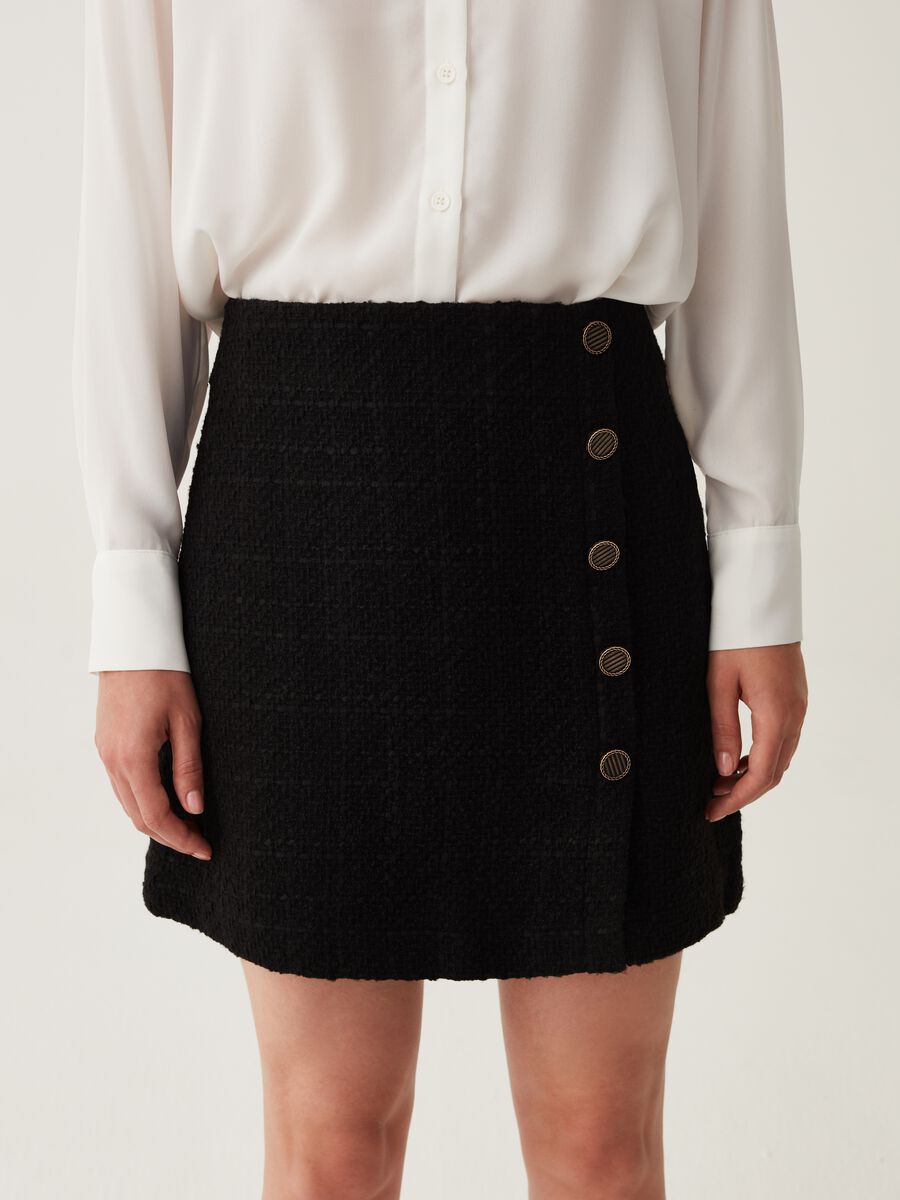 Minifalda de tweed con botones decorativos_1