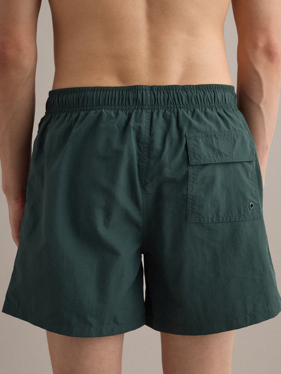 Green swim shorts with elasticated waistband and drawstring_4