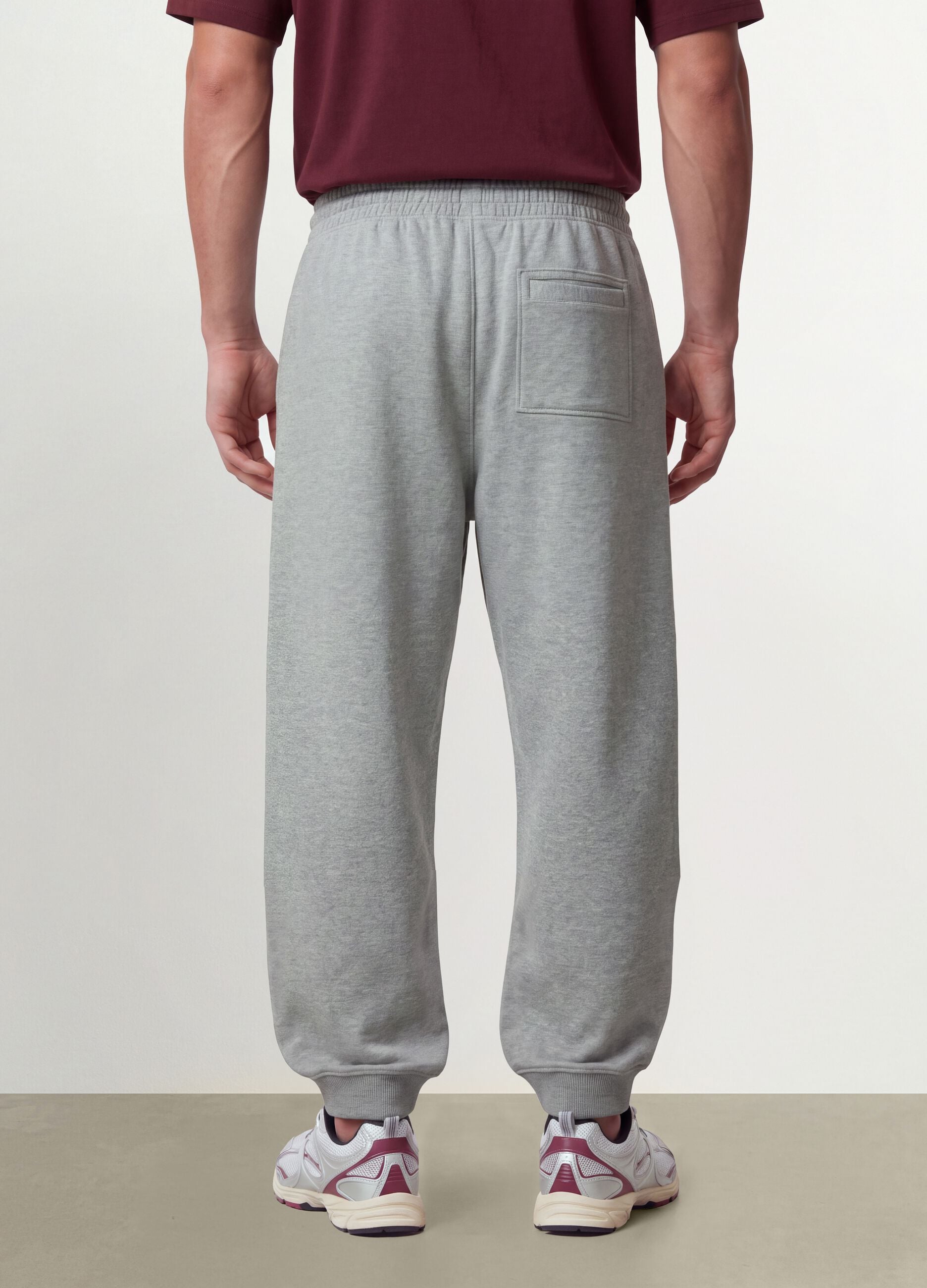 Grey cotton-blend joggers with cuffed hems and drawstring