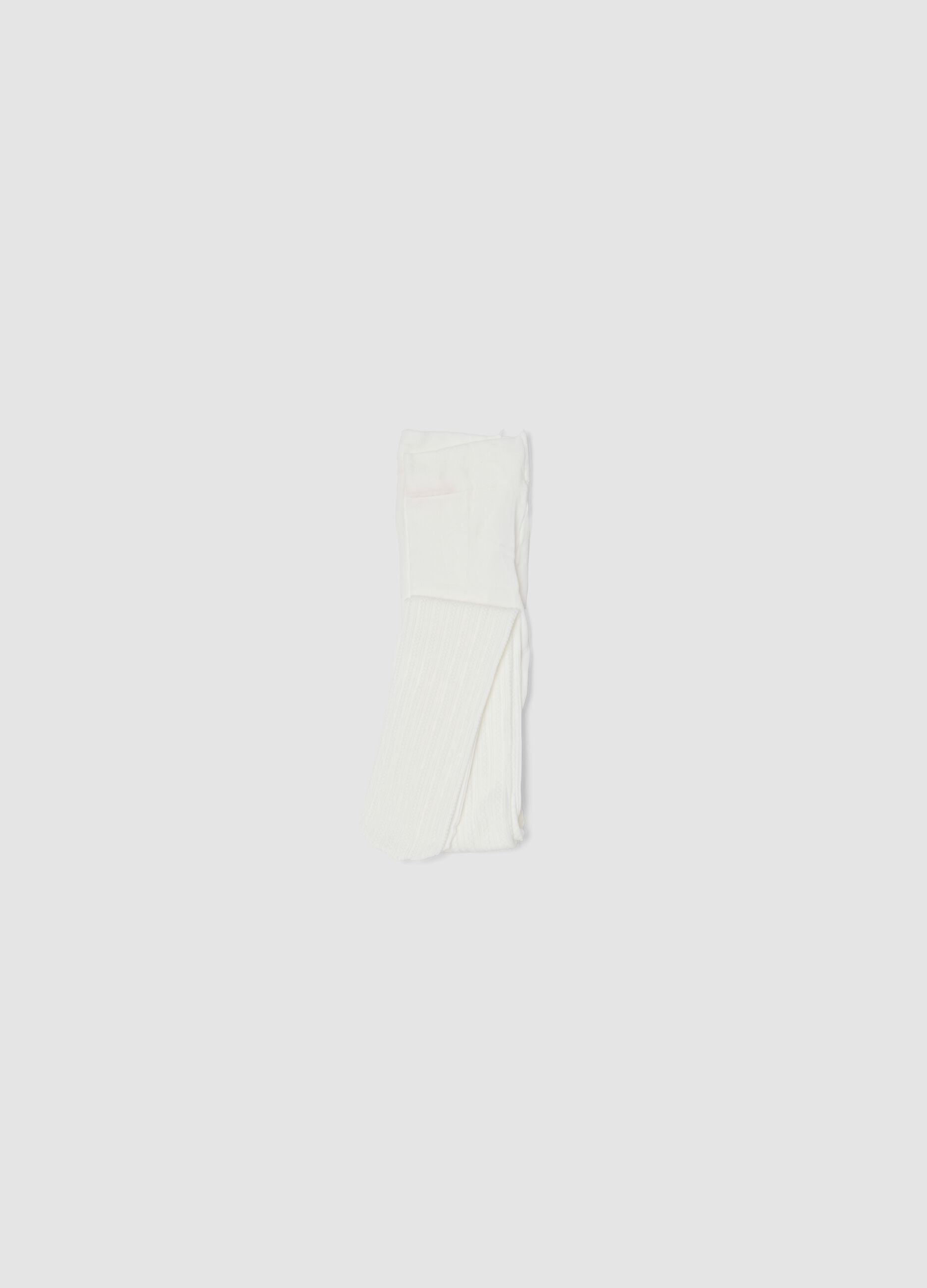 Collant bianco in tessuto elasticizzato con motivo lavorato