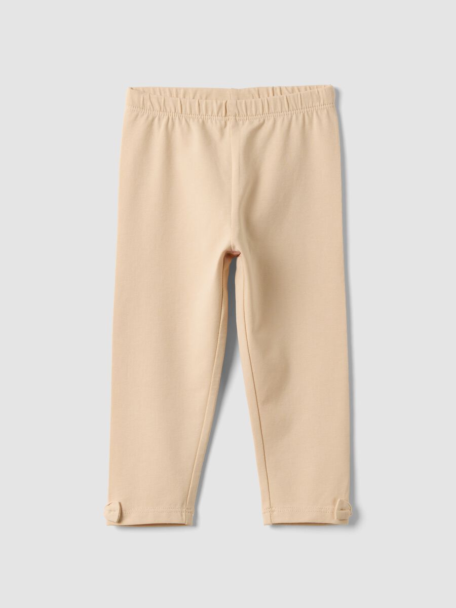 Beige stretch organic cotton leggings with bows for baby girl_0