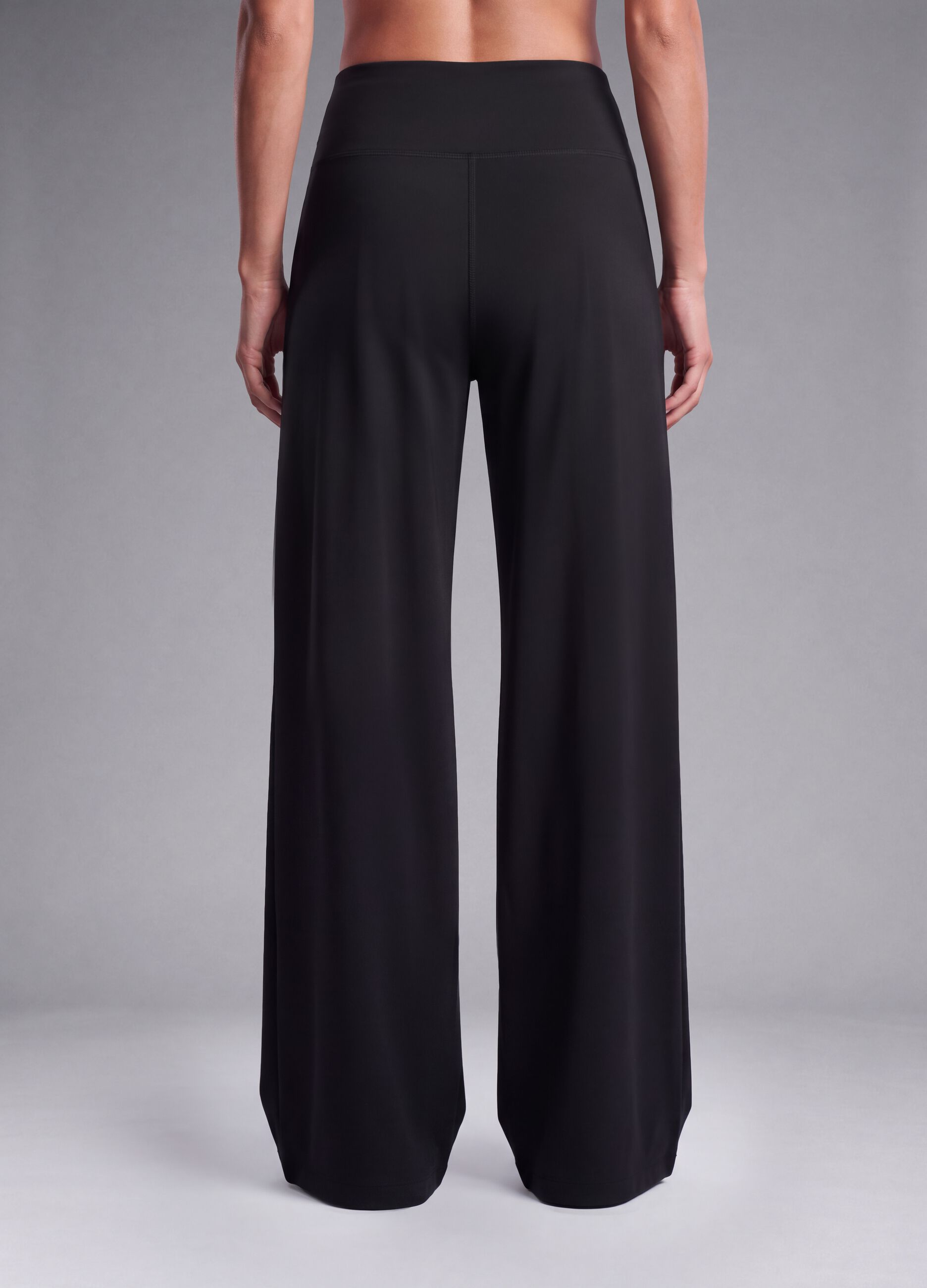 Black wide-leg stretch-fabric trousers