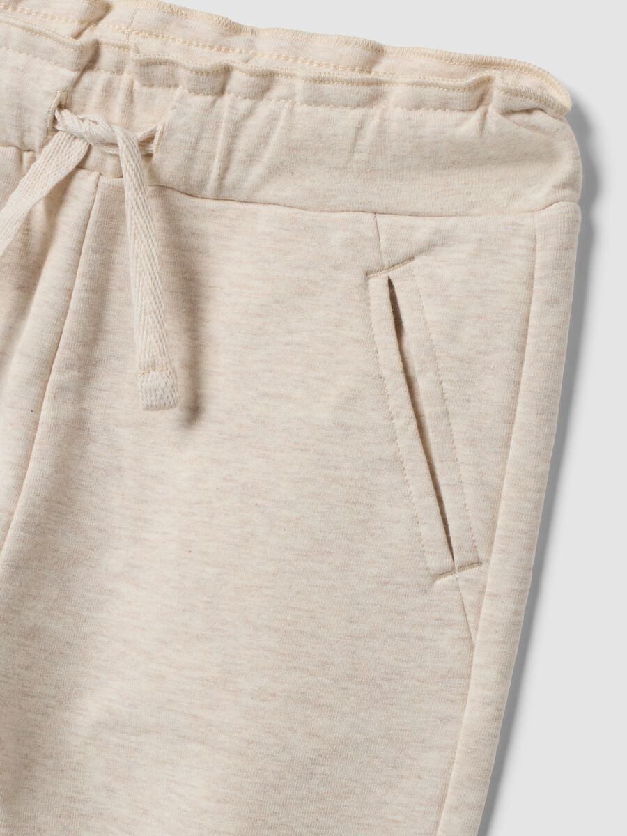 Beige stretch cotton joggers with turn-up cuff for baby girl_2