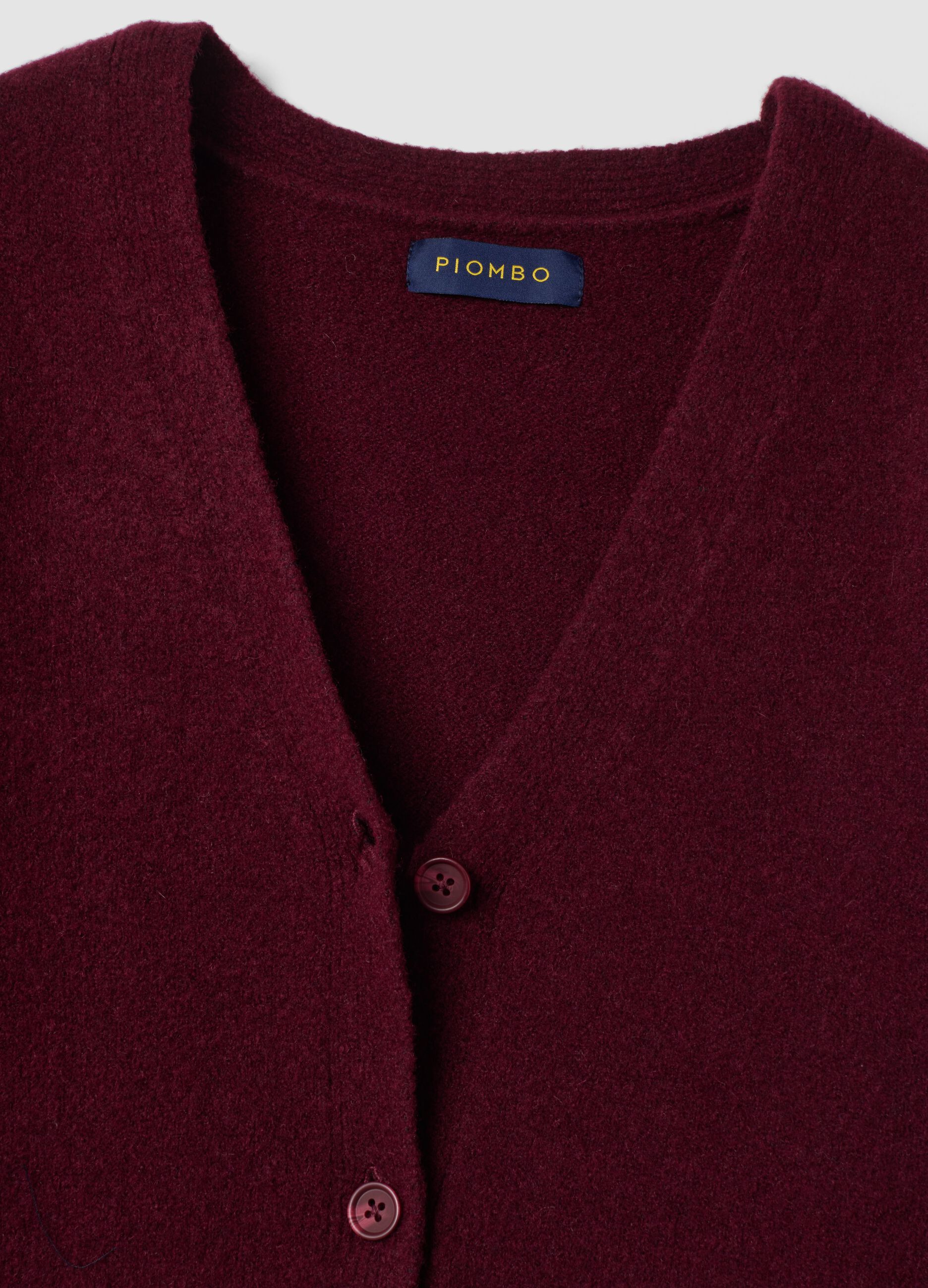 Cardigan rosso in lana elasticizzata con scollo profondo a V