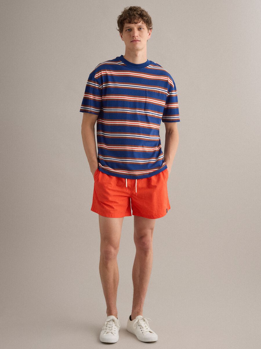 Orange swim shorts with elasticated waistband and drawstring_1