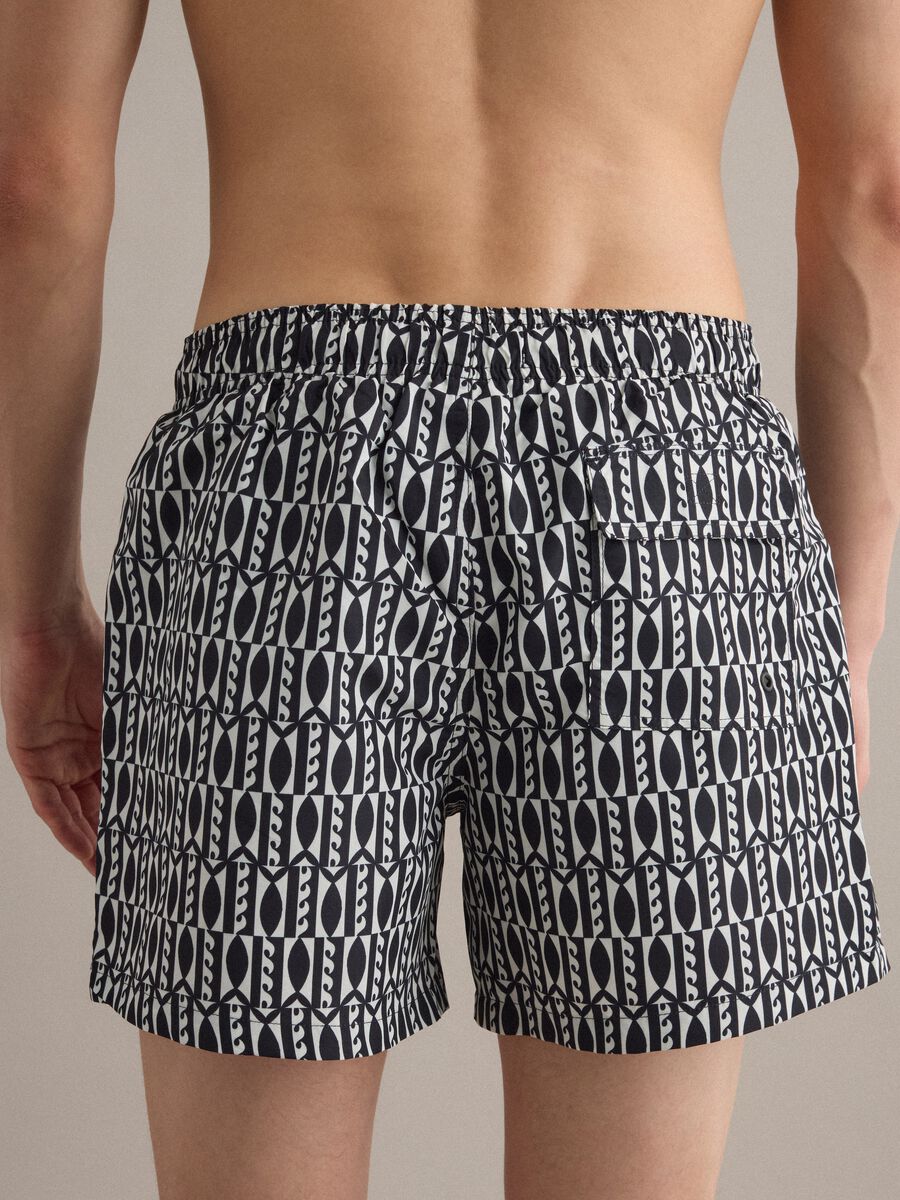 Blue swim shorts with graphic print_3