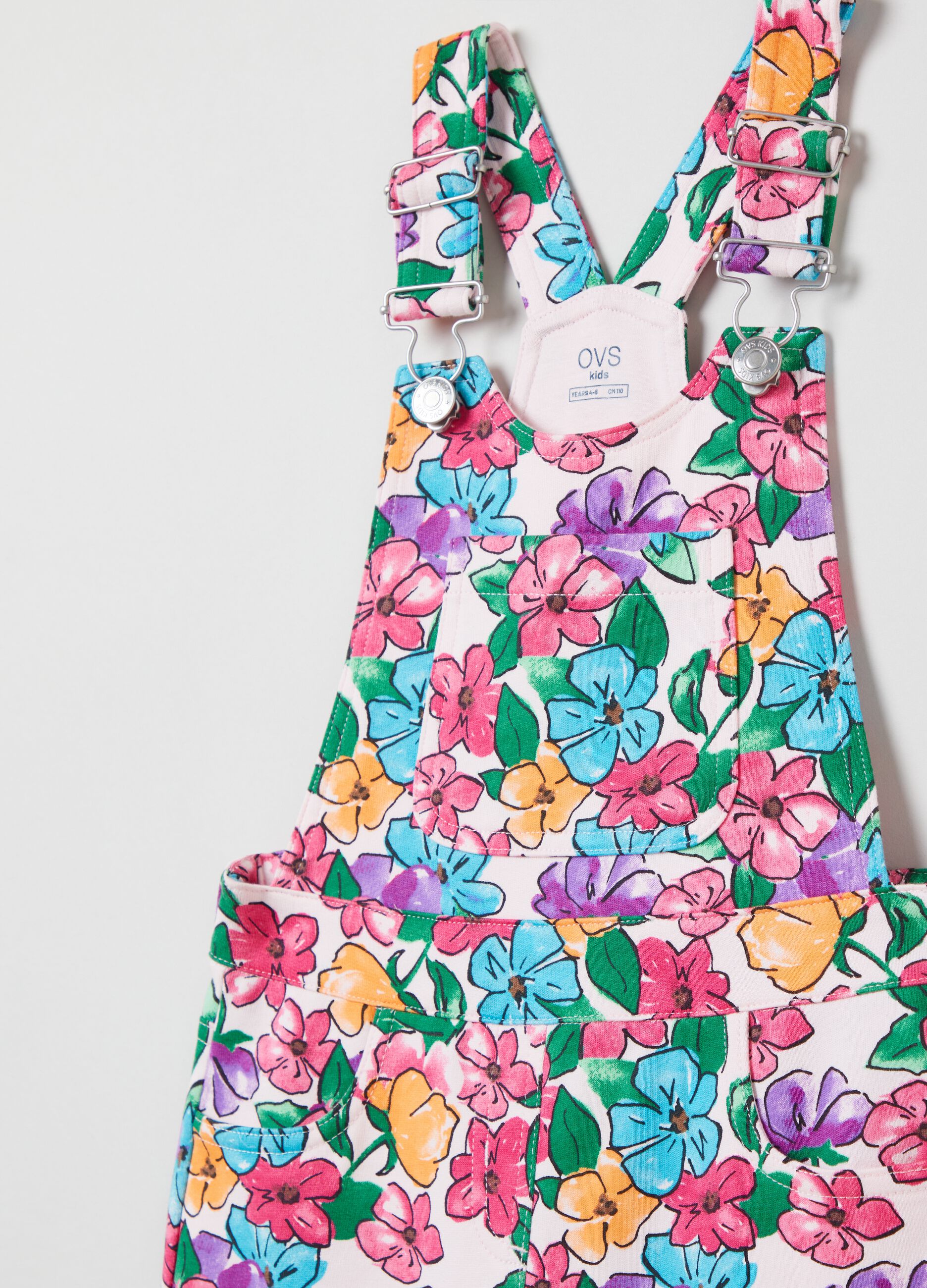 Short dungarees with flowers print