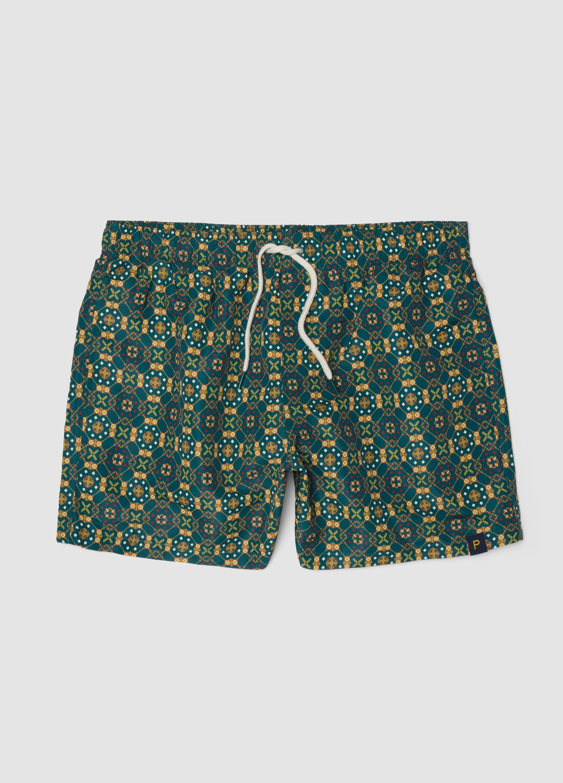 Green patterned swim shorts with elasticated waist
