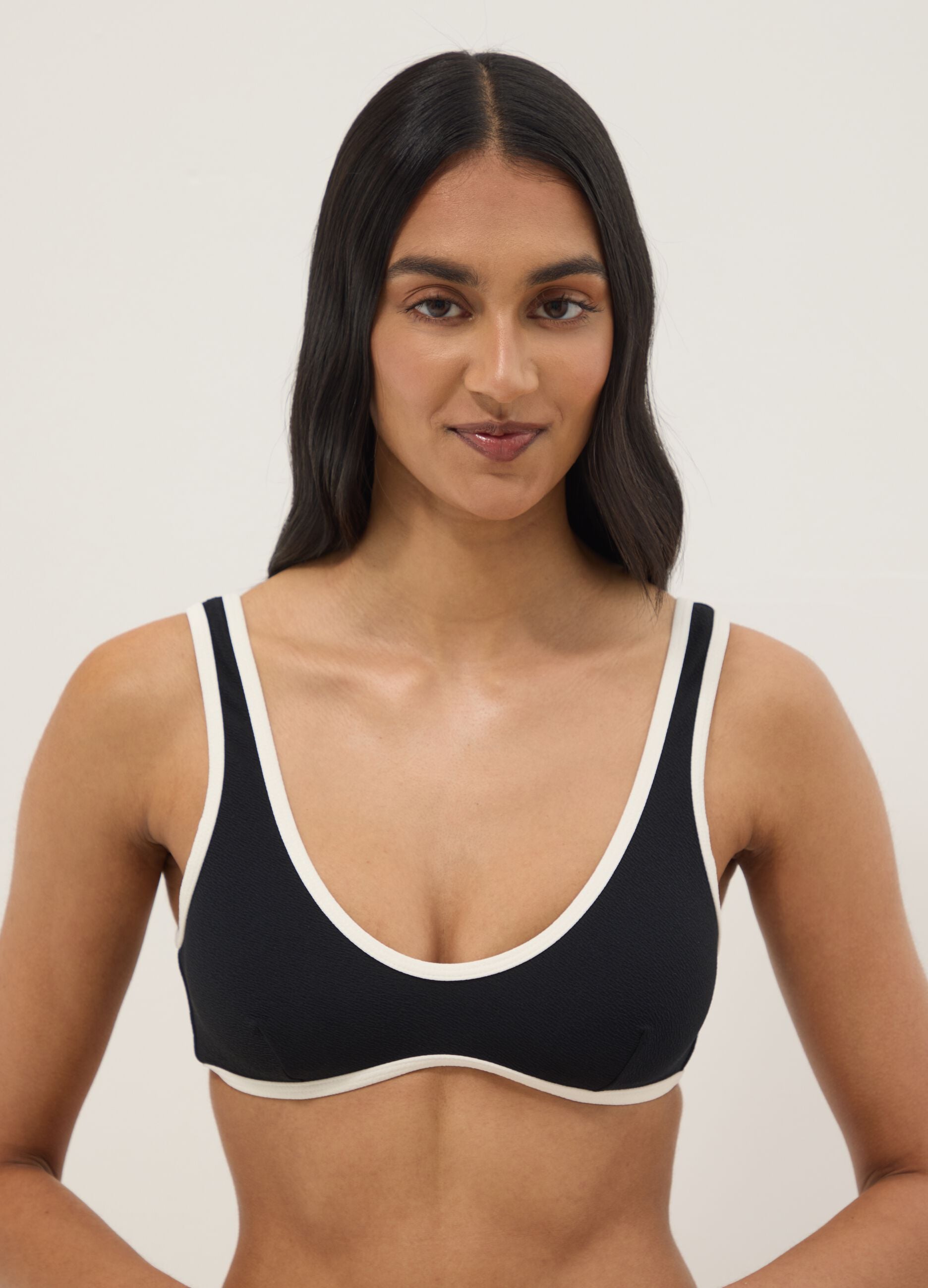 Black stretch fabric bikini top with white trim