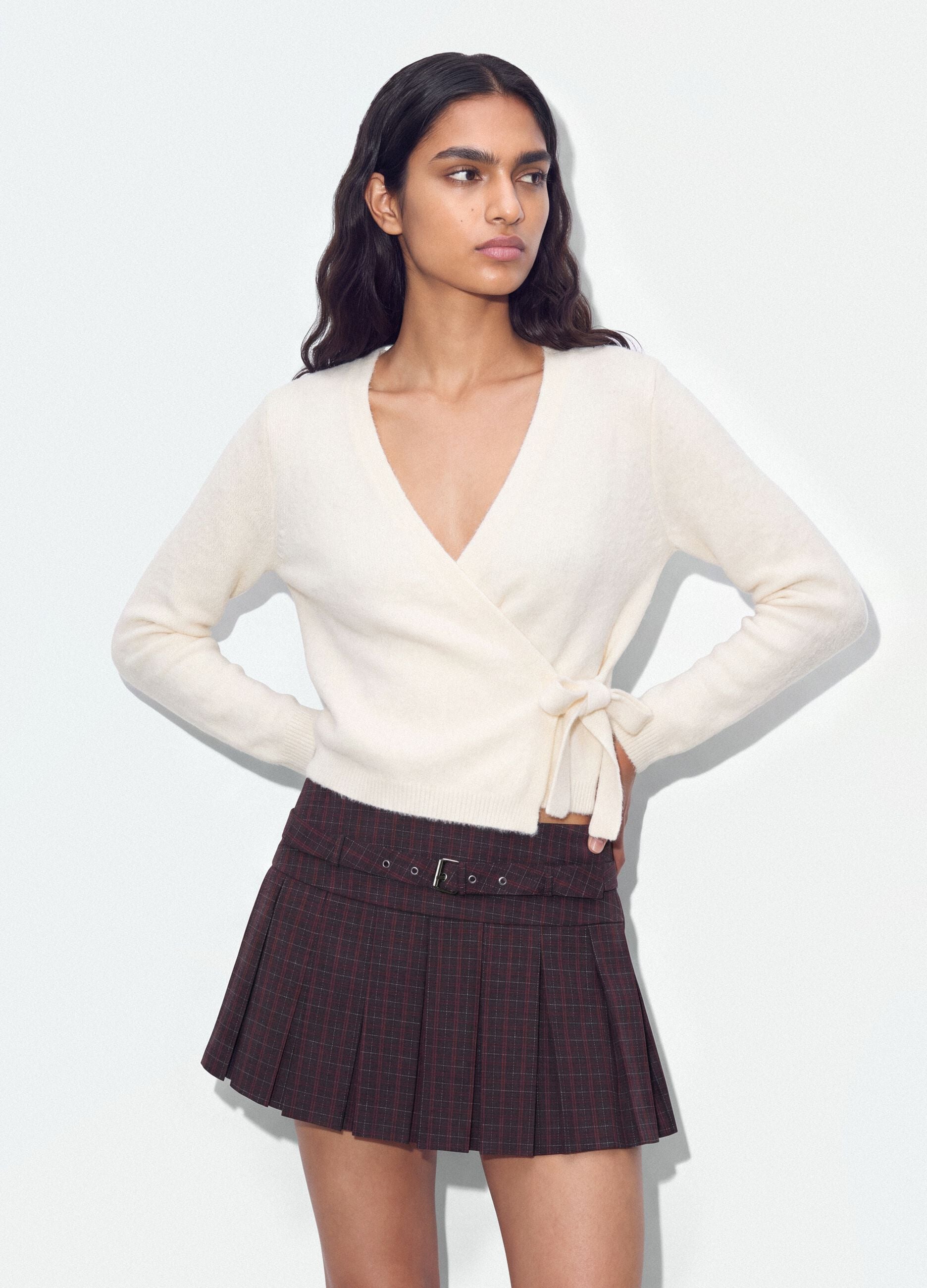 White wrap cardigan with deep V-neck