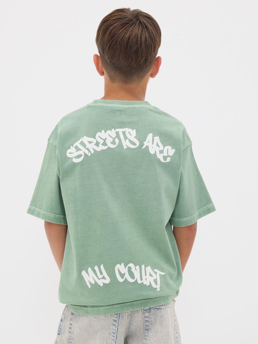 Green oversized pure cotton T-shirt with "Streets are my court" slogan for boys_1