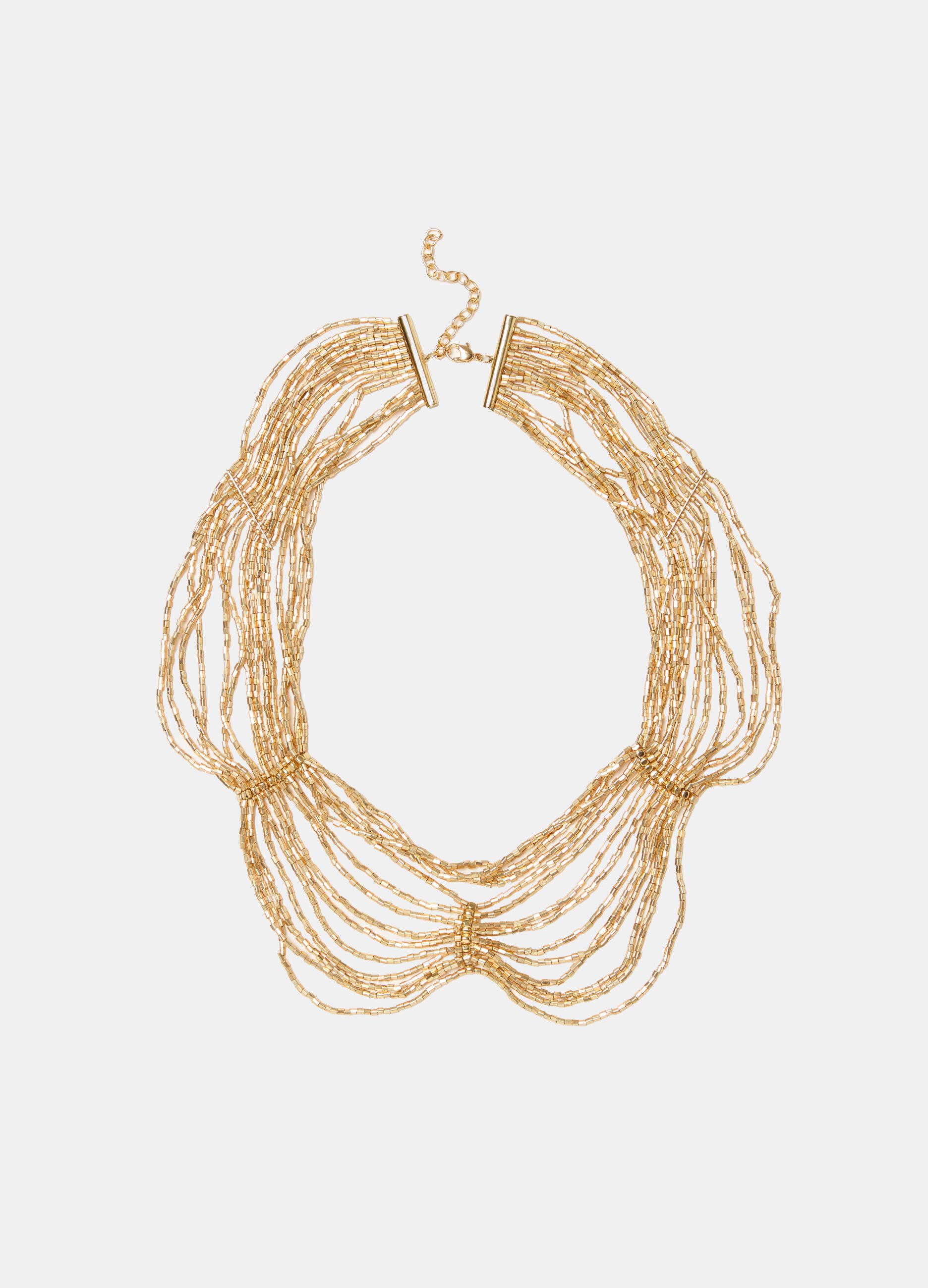 Multi-string necklace with golden beads