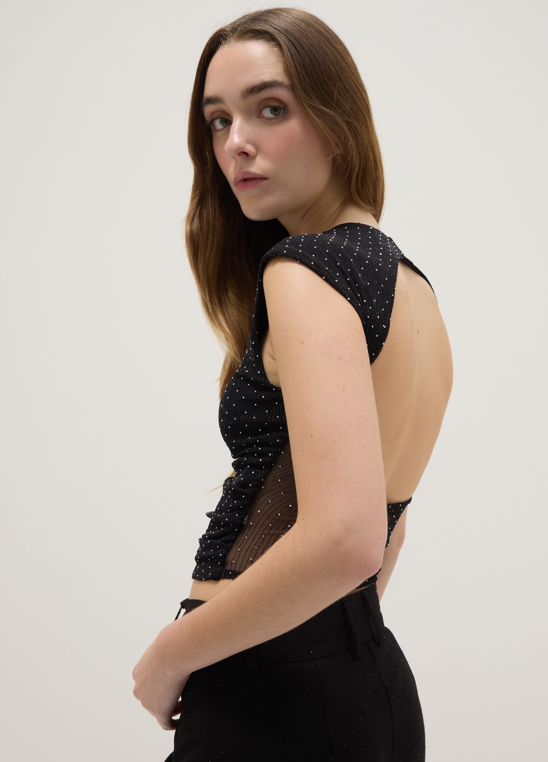 Black sleeveless top regular fit with back open and rhinestones